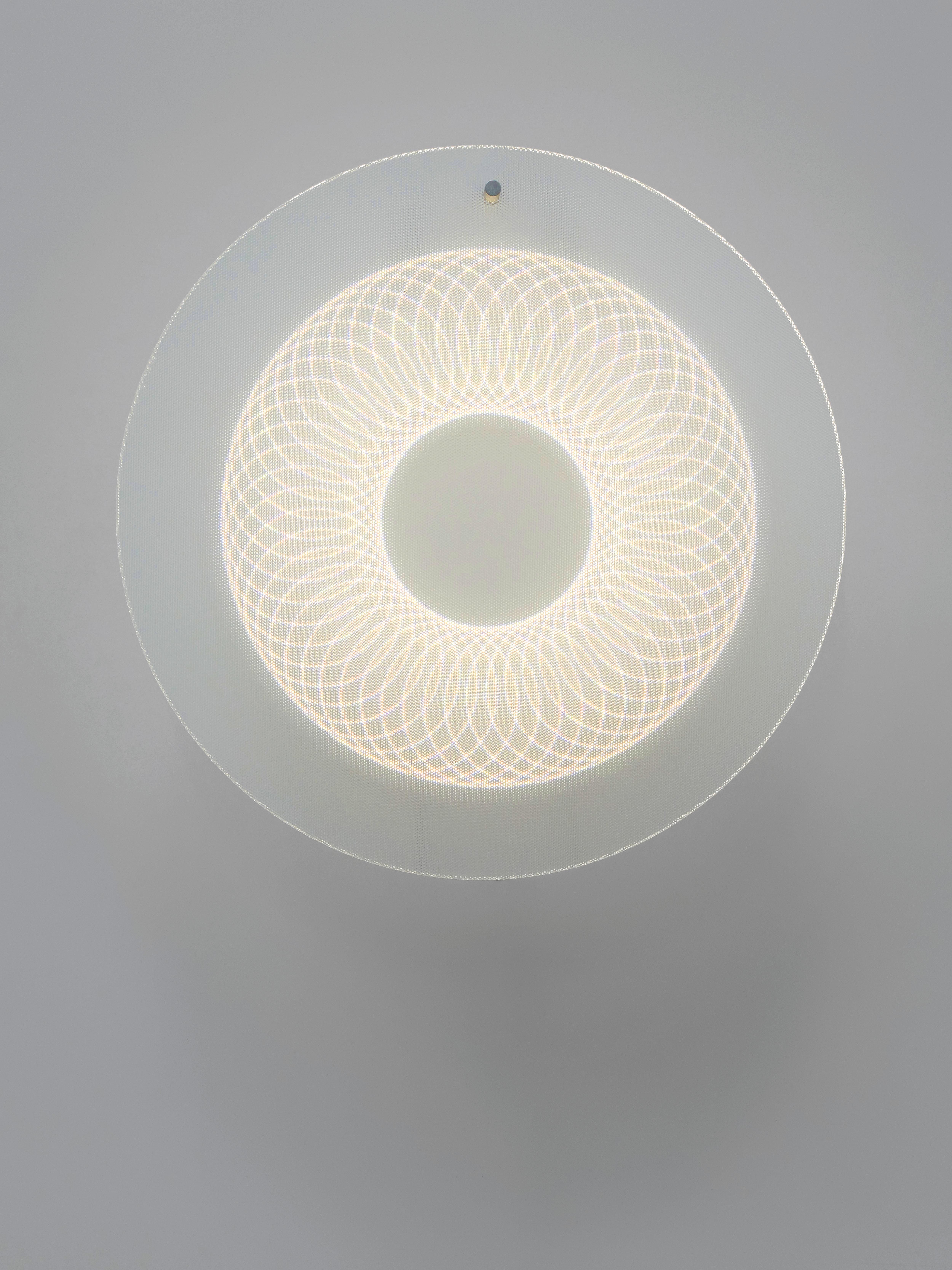 Every lamp encapsulates a shape of light that changes depending on your position in space. Faced head on you see a geometrical pattern, but seen from an angle the shape distorts and its depth accelerates. The led points function not only as a source