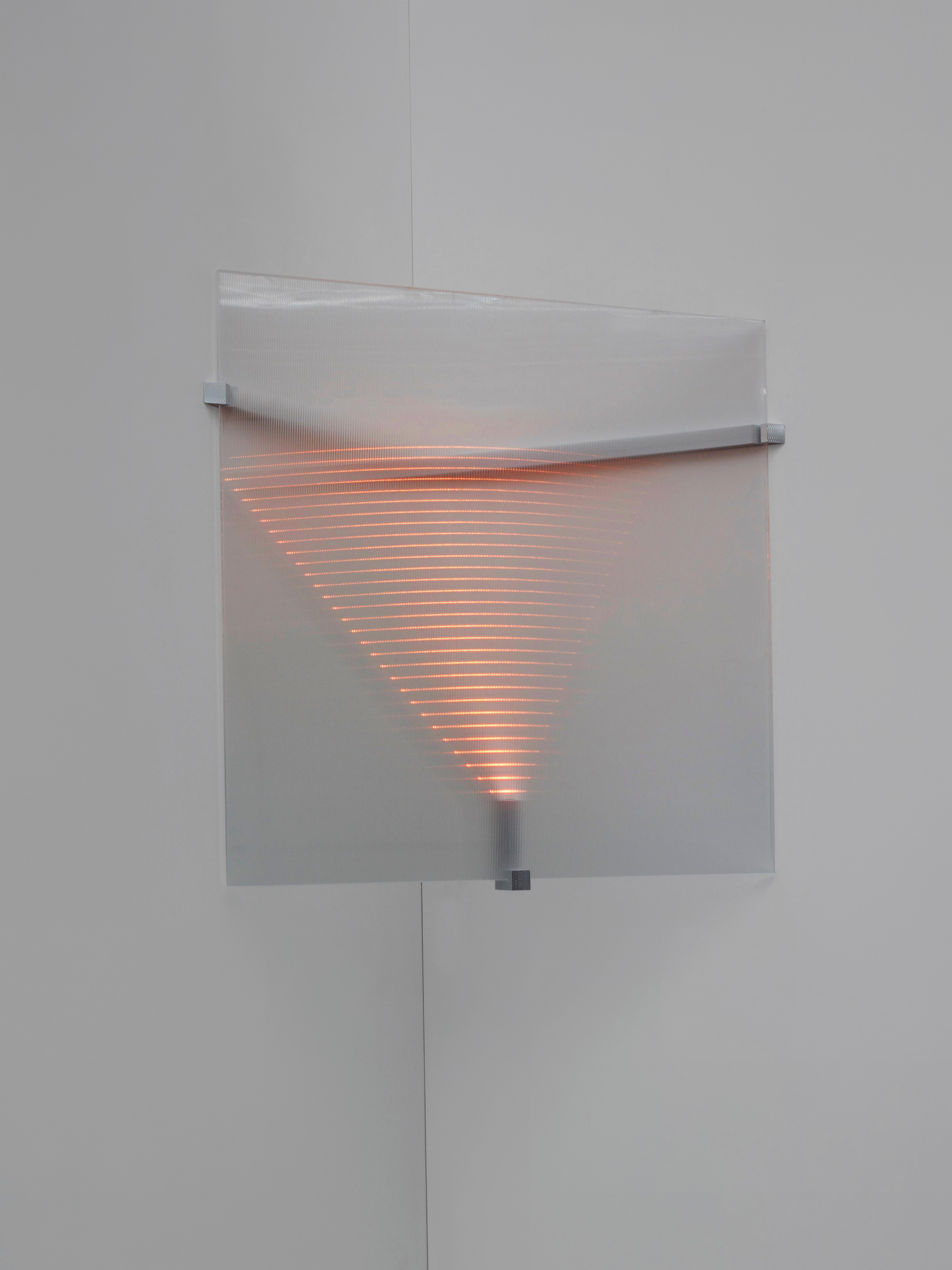 Every lamp encapsulates a shape of light that changes depending on your position in space. Faced head on you see a geometrical pattern, but seen from an angle the shape distorts and its depth accelerates. The led points function not only as a source
