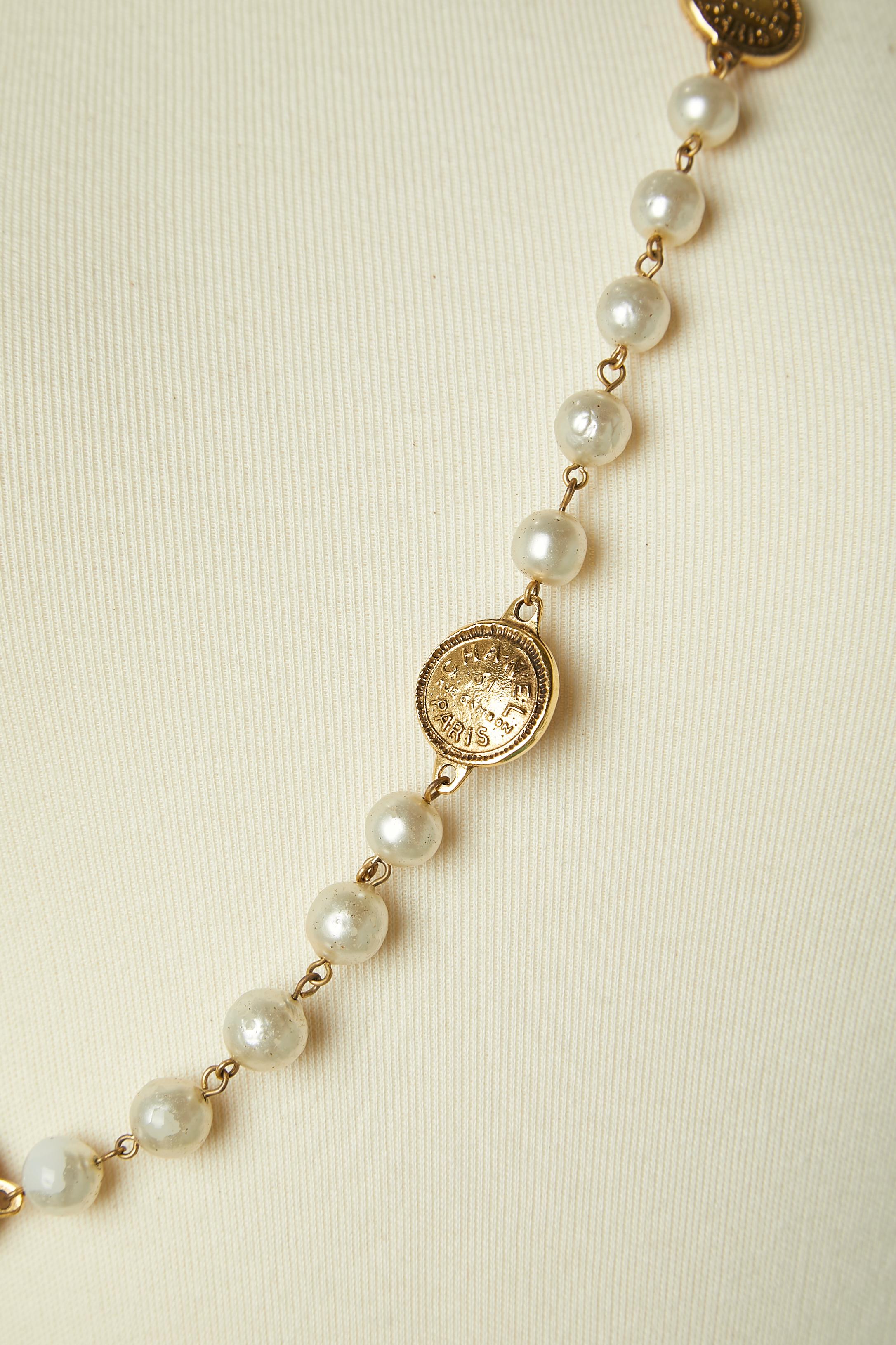 Women's One row sautoir mix pearls and branded coins Chanel Circa 1980's  For Sale