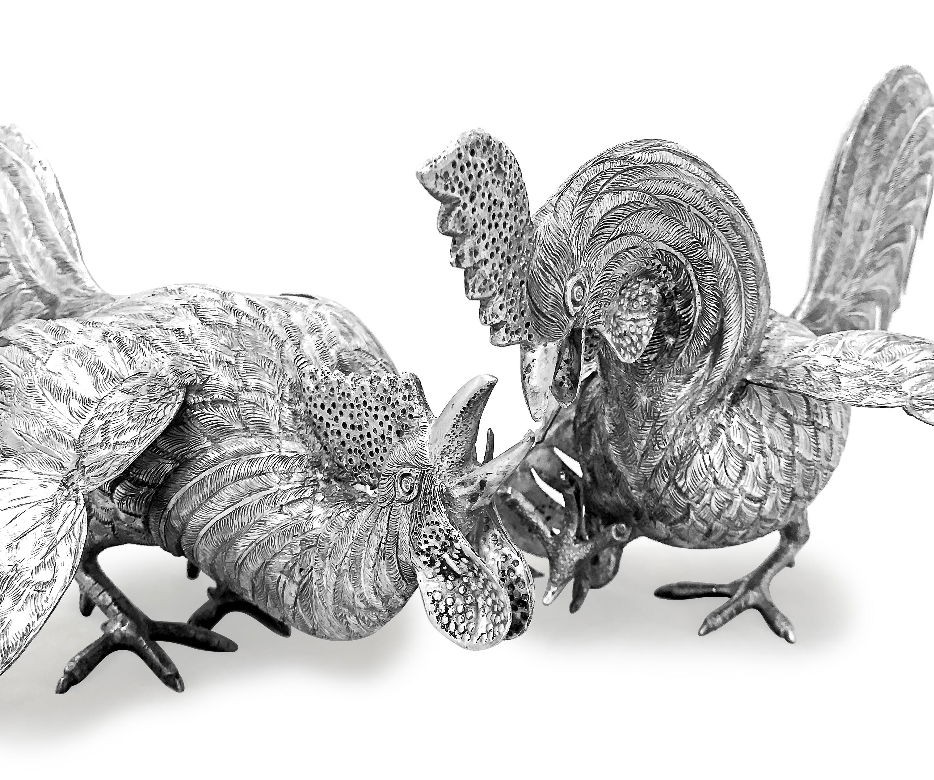 Absolutely gorgeous piece of art . Hand made sterling silver pair of roosters that  are fighting . They look extremely unique and real .One of them has his head down with one feet up with his beautiful wings one open and one half open. The other