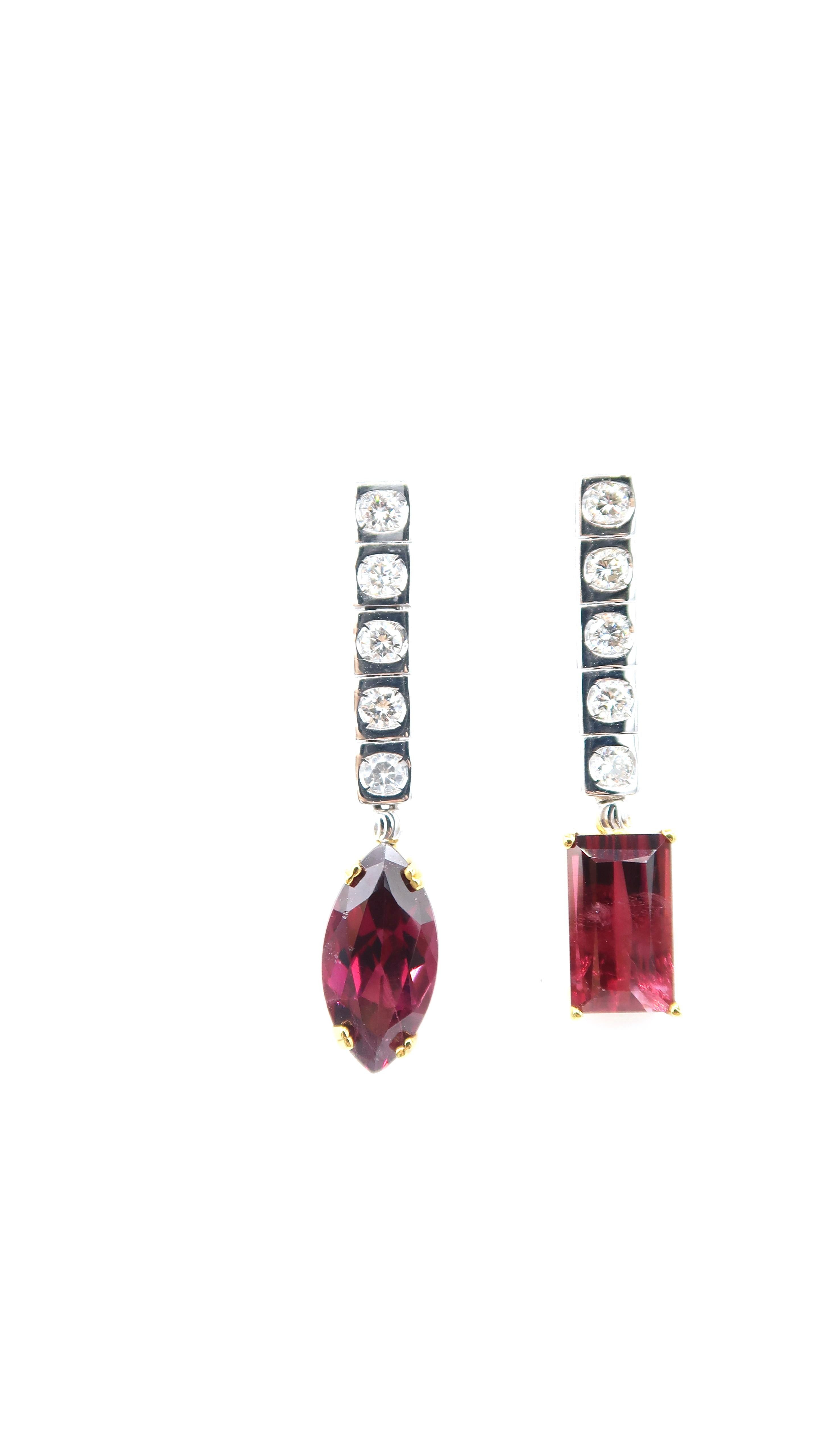 Square Shaped Long Tennis Earrings in 18K Gold with Round Diamonds and Mismatchedan Oblong Rubellite and a Marquis Rubellite

Gold: 18K Gold 7.3g.
Rubellite: 7.18cts.
Diamond: 0.50ct.

