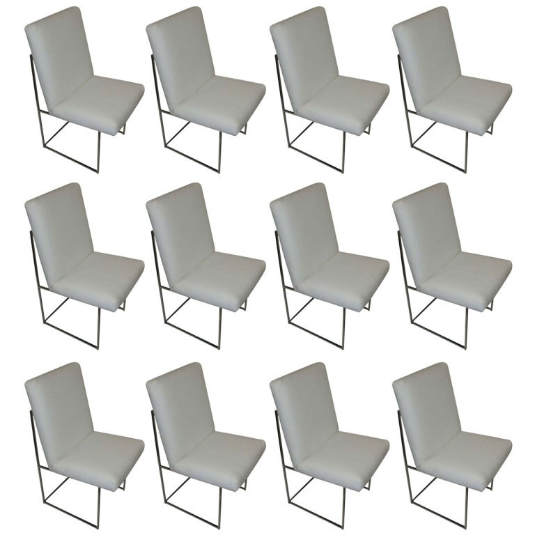 Mid-Century Modern Thin Series dining chairs designed by Milo Baughman. Newly reupholstered in white leather with chrome frames.

Also available in black.

Measures: Seat height 17.5