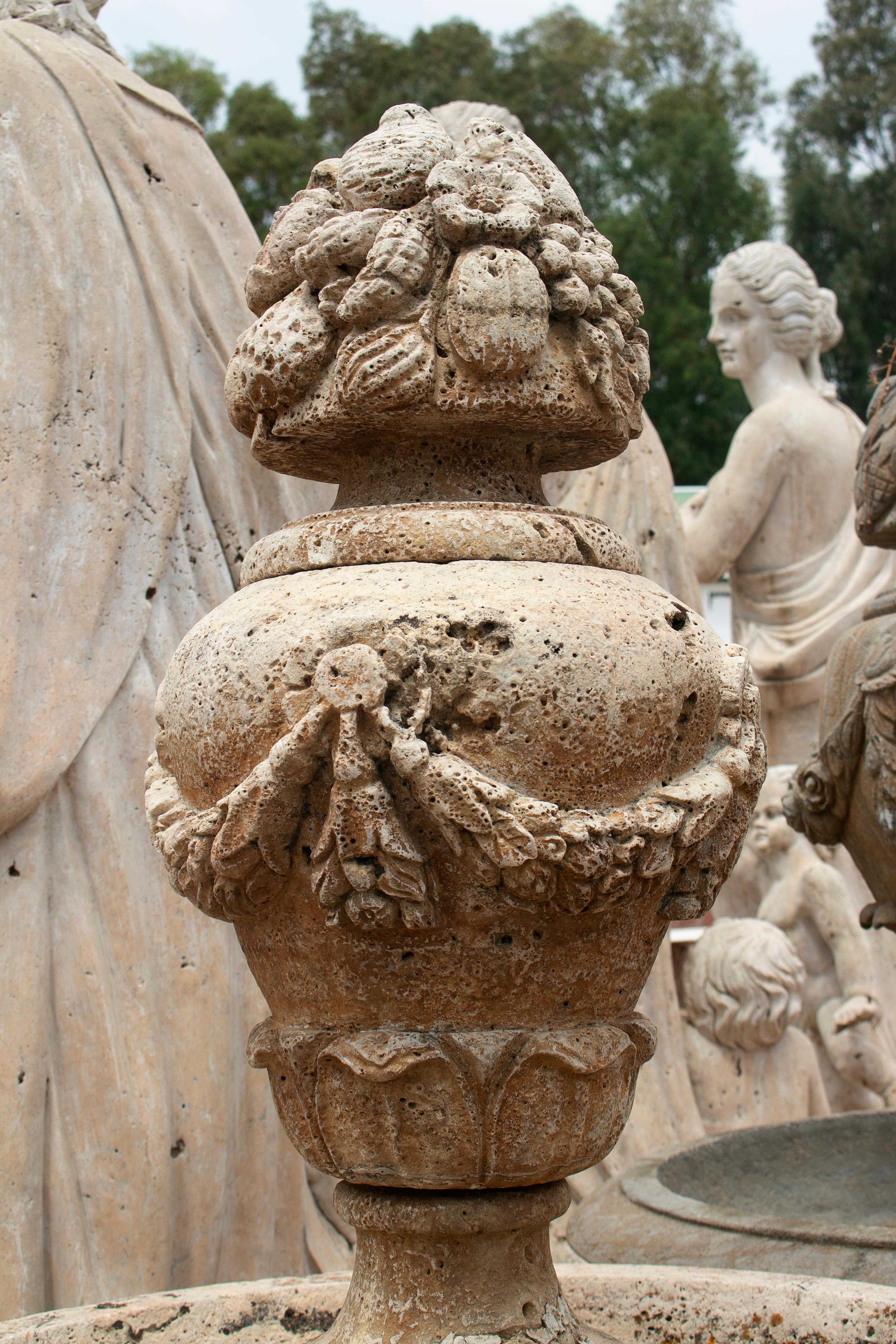 One-tier fountain hand carved in Romano travertine marble.