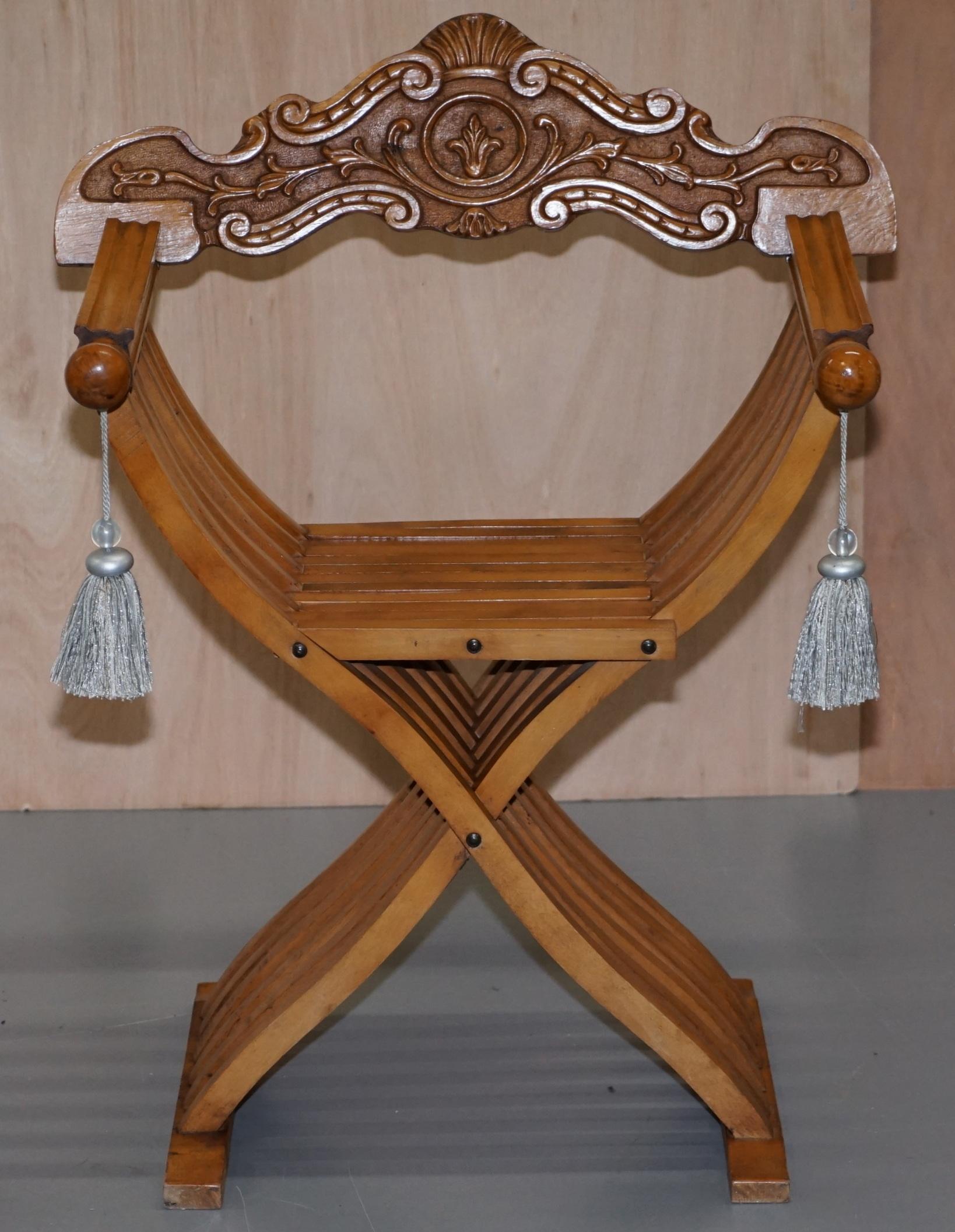 We are delighted to offer for sale one of two Savonarola armchairs

I have a pair, this auction is for the traditional chair with the rounded arms and silk tassels, the other chair which is listed under my other items has Lion head arms

These