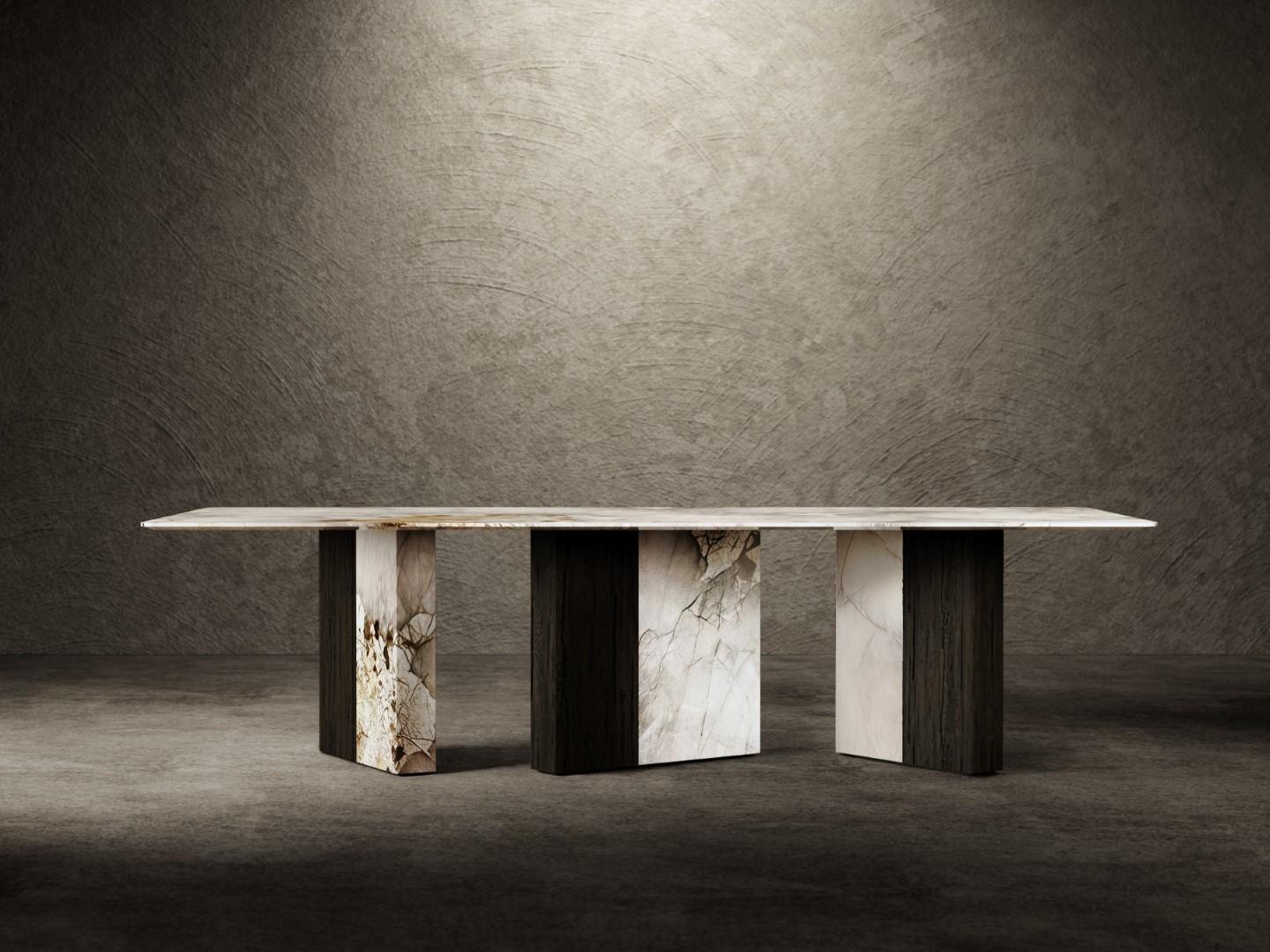 One Way Or Another dining table is composed of a top in Patagonia marble with diamond-cut on the lower edge, reinforced by a metal support fixed to three asymmetrical legs. 
Each leg is covered with a different combination of Patagonia marble slabs