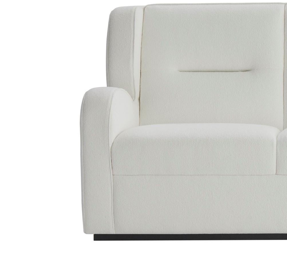 Modern O'neill Sofa in white boucle fabric with black lacquer plinth For Sale
