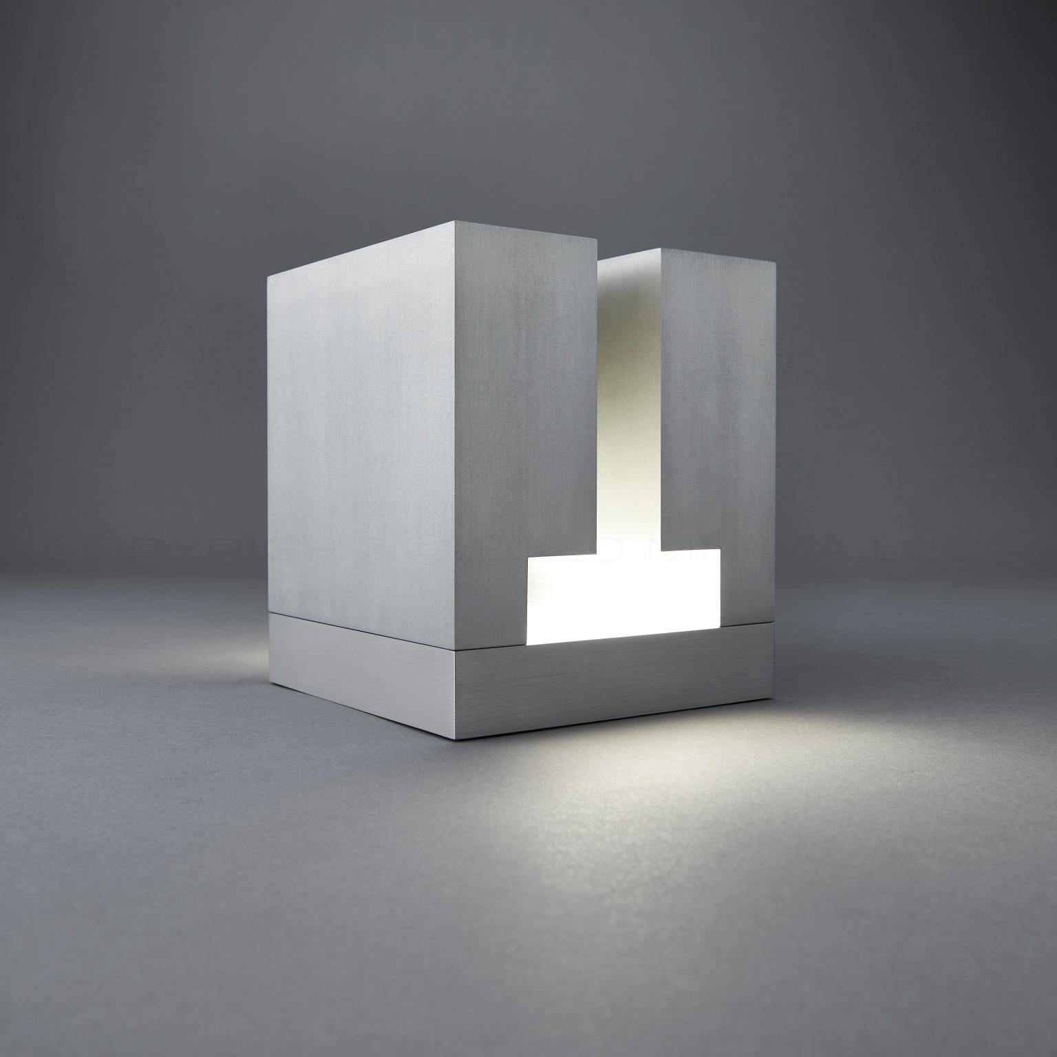 Onera2 by mnima. Table light sculpted from solid aluminum. Modern. Minimal.

Physical
Material 6061 aluminum
Finish clear anodize shown
Weight 9.1lb

Electrical
Input 90-264Vac 50-60Hz
Output 7.5Vdc 0.366A 2.75W
Dimming high-low