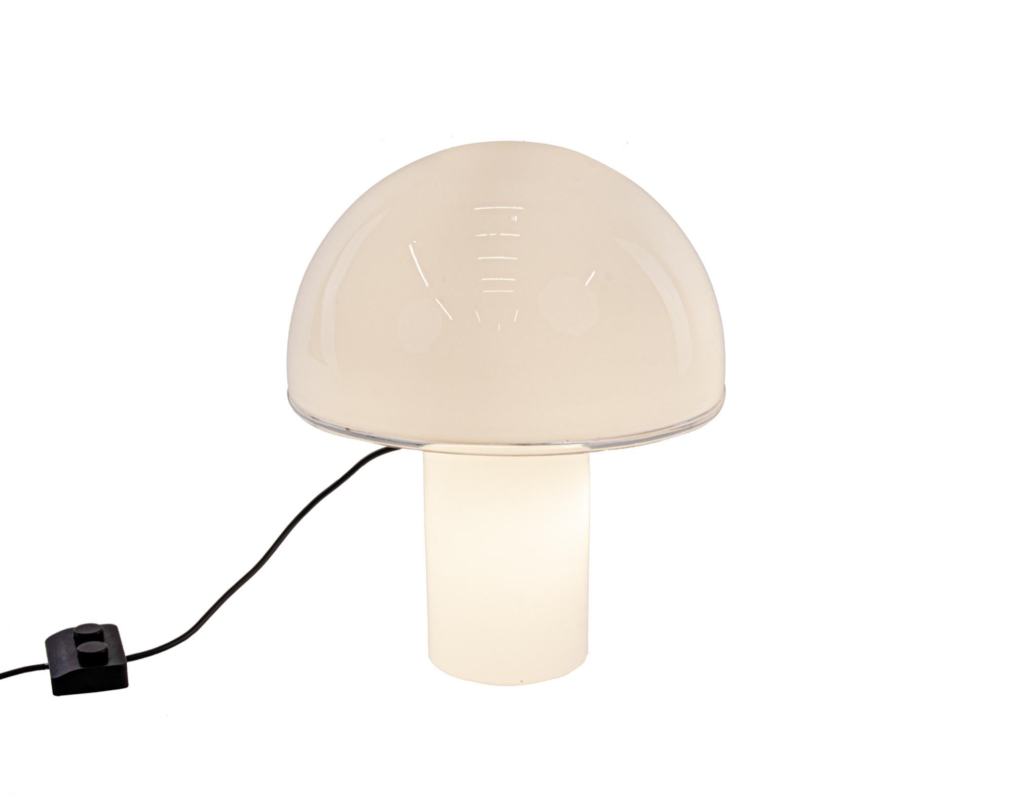 Onfale Tavolo Big - the large version of the mushroom lamp made of hand blown white opaline Murano glass and designed by Luciano Vistosi in 1978.

Body and diffuser in white opaline blown glass. Transparent crystal edge added. Lights can be switched