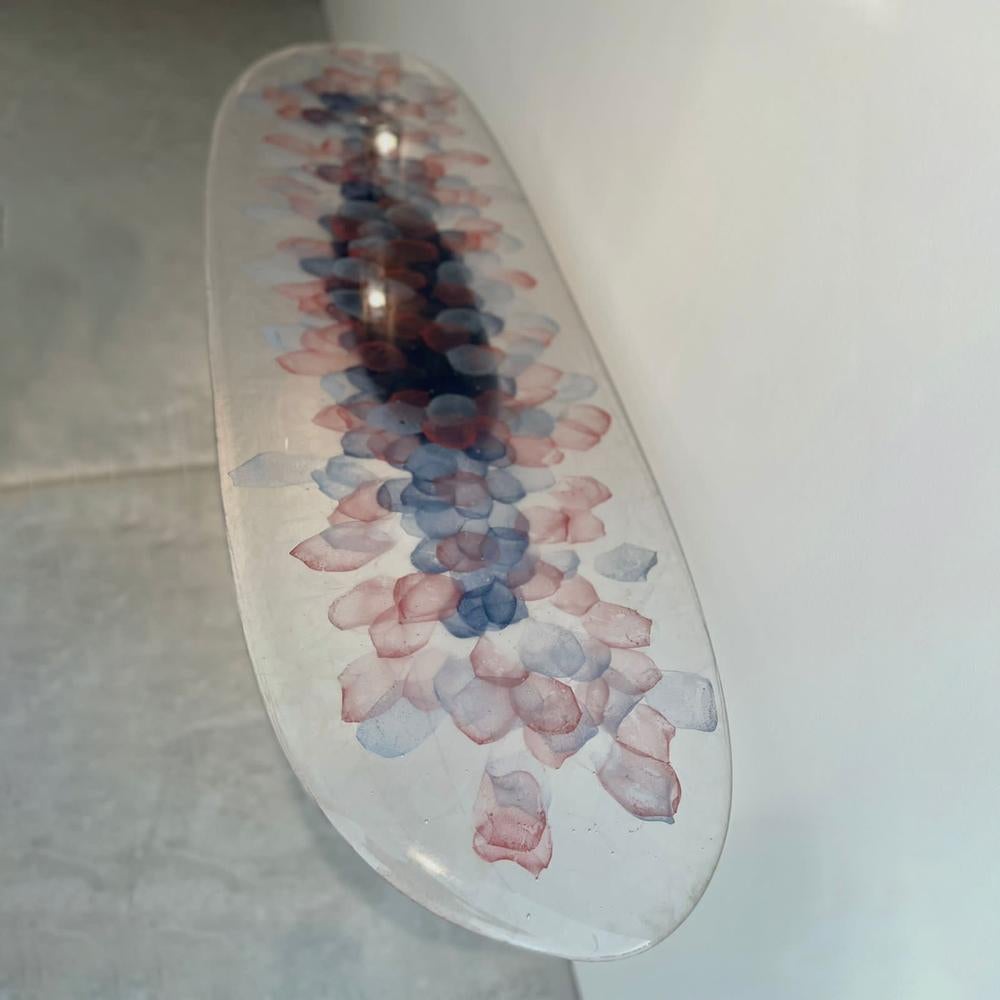 This unique sculptural console in ceramic base, bronze details, and kiln cast pollen glass top console took three months to make. Atelier Stefan Leo used old craftmanship to infuse glass pigment nuggets inside the pollen glass countertop and baked