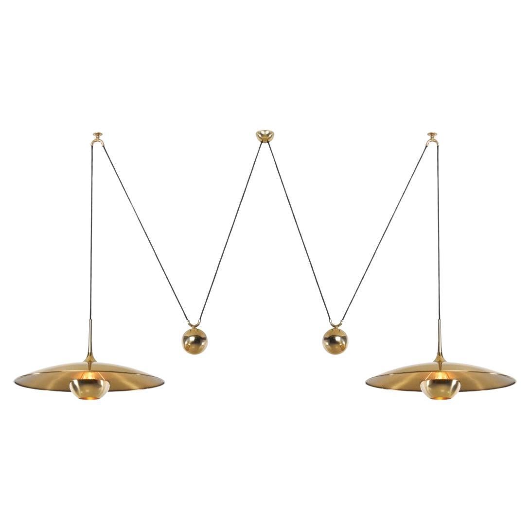 Onos 55 Double Counterbalance Lamps in Brass by Florian Schulz