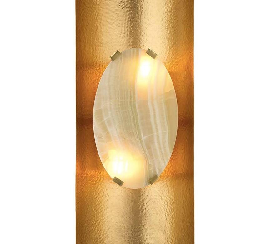 This stunning sconce is a touch of lavish elegance into a sophisticated interior. Either to flank an entryway mirror, to adorn a living room, or to illuminate a bedroom, this piece will imbue any room with luxury and brilliance. The elongated