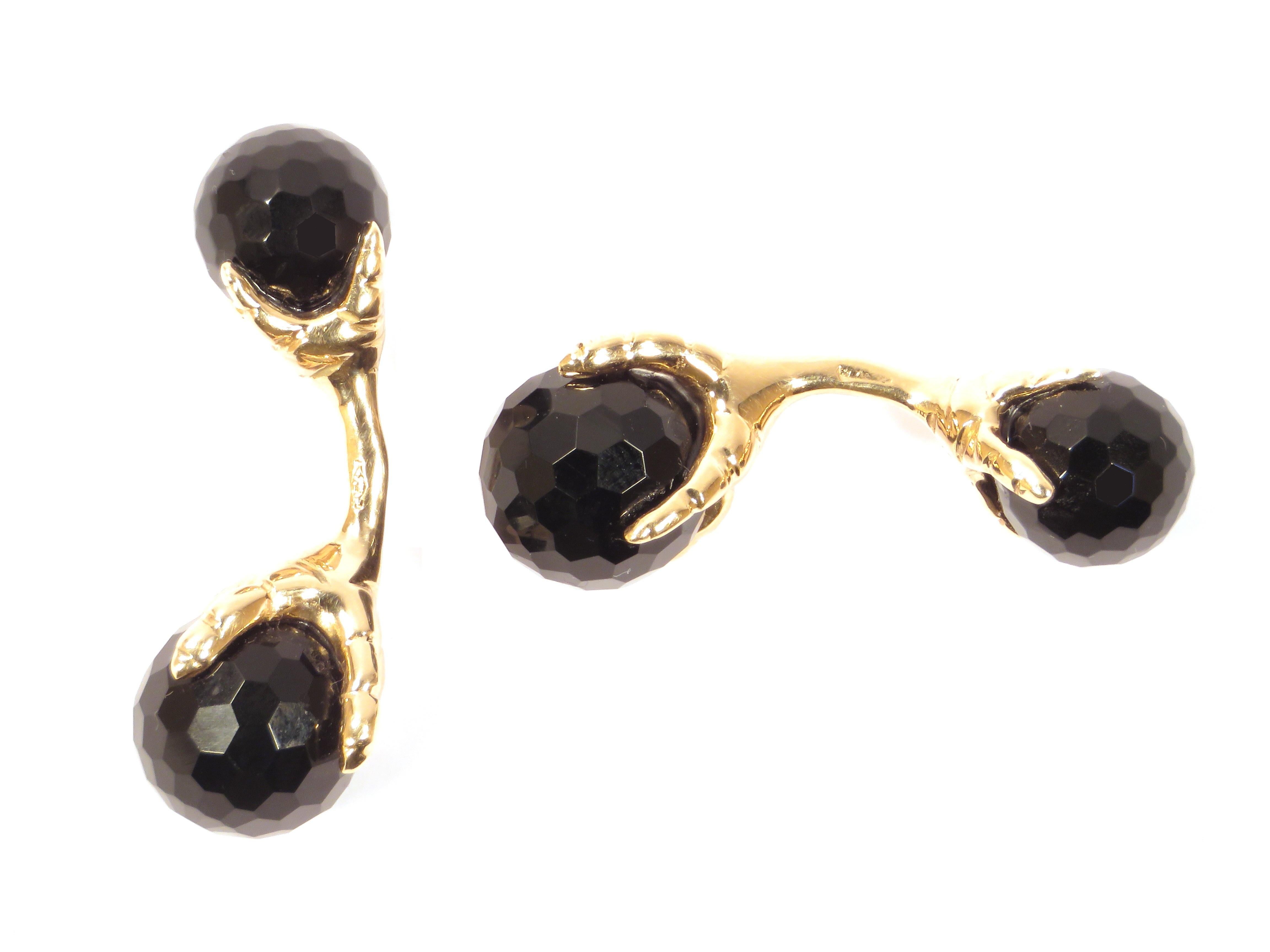 Beautiful cufflinks crafted in 9k rose gold featuring eagle talons grabbing faceted onyx beads. The size of the bigger beads is 12 millimeters / 0.472 inches and of the smaller ones is 10 millimeters / 0.393 inches.  These cufflinks are handcrafted