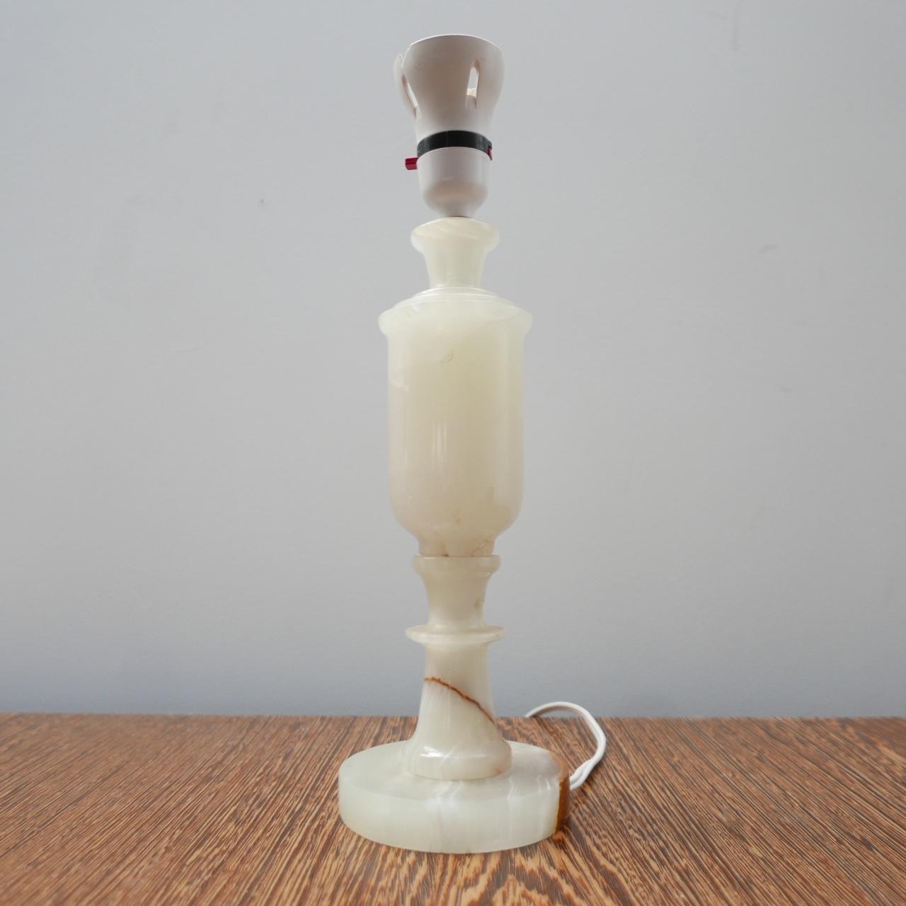 A well formed onyx or alabaster table lamp. 

England, c1970s. 

Good condition. 

Will be re-wired, likely with a brass bulbholder and silk flex. 

Location: London Gallery. 

Dimensions: 33 H x 10 Diameter in cm. 

Delivery: POA

We