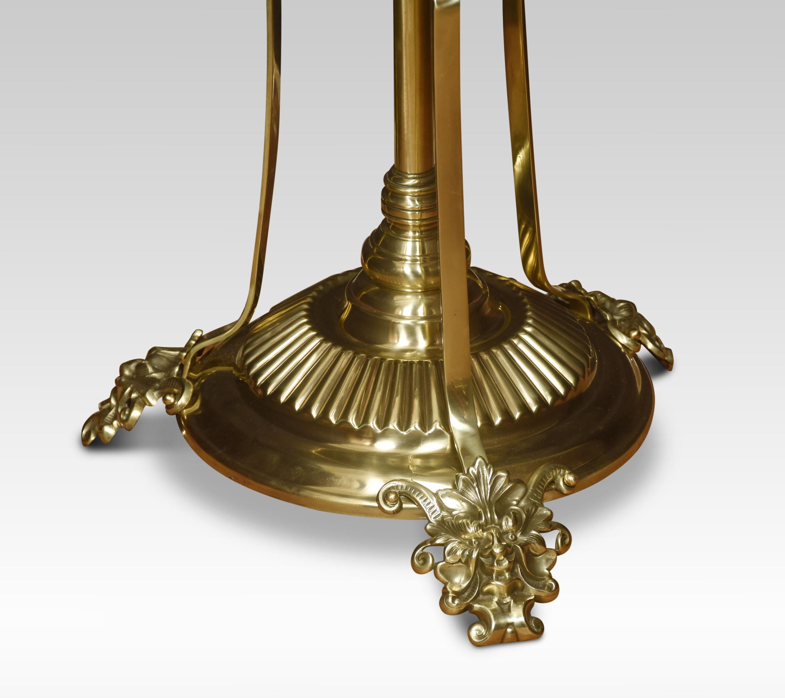 19th century brass and onyx standard lamp, having turned central column, to the circular onyx shelf. All raised up on three splayed supports above a circular plate terminating in scrolling feet. The lamp has been rewired and