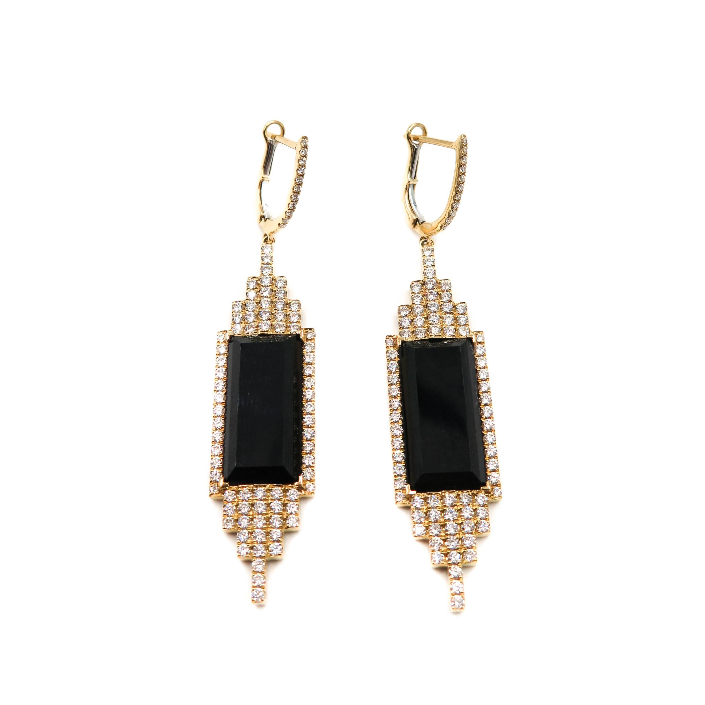 Inspired by the style and grandeur of the roaring twenties. Black Onyx and Diamonds are set in geometric vintage settings with delicate pavé details. 
This gorgeous Onyx and Diamond Drop Earrings, an homage to fashion's golden era is crafted in 18k