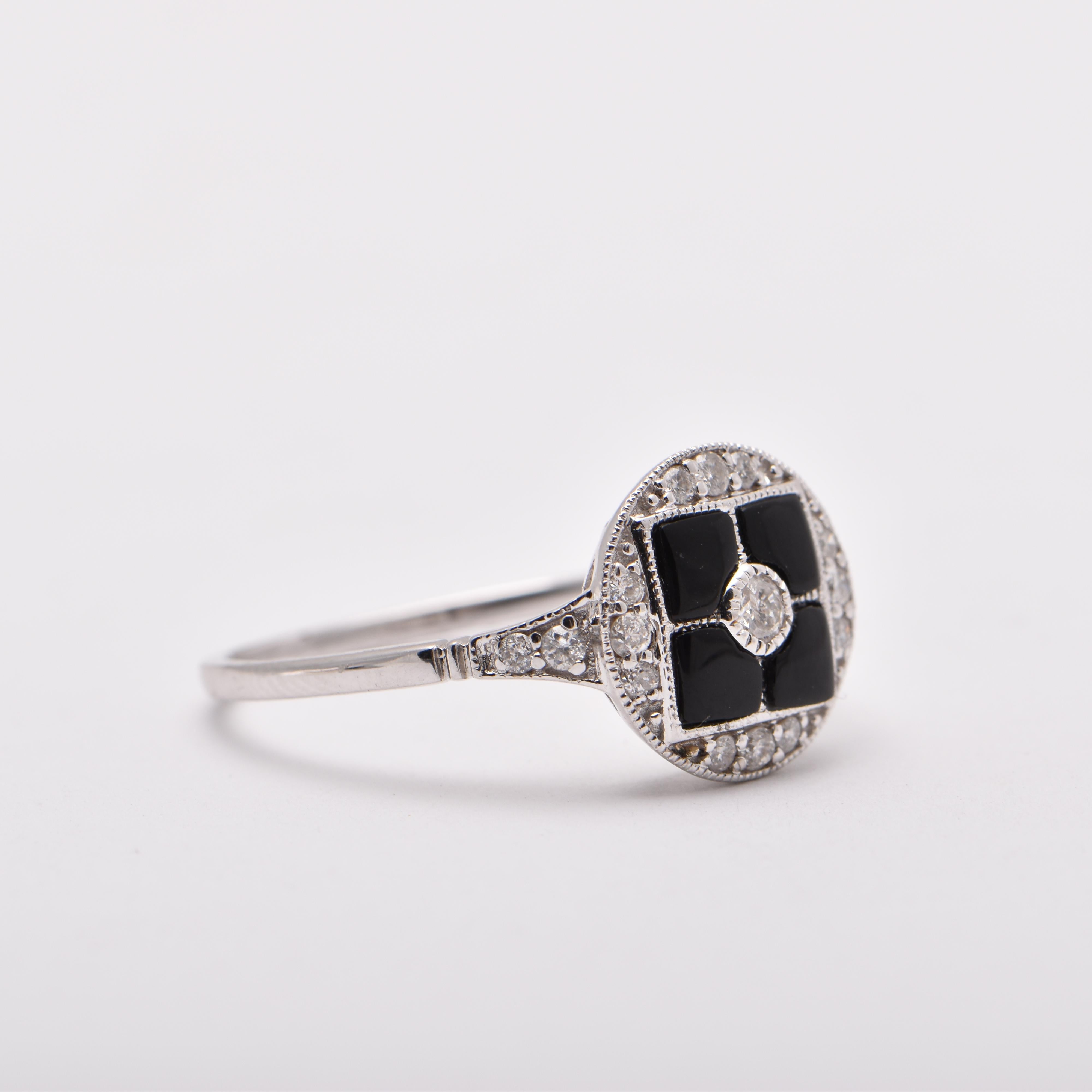 Onyx and Diamond Art Deco Style Ring in 18 Carat White Gold by Cartmer Jewellery

Size O

Onyx totalling 0.55 Carats
17 Diamonds totalling 0.24 Carats
18 Carat White Gold Ring

FREE express postage usually 3-4 days Sydney to New York
FREE