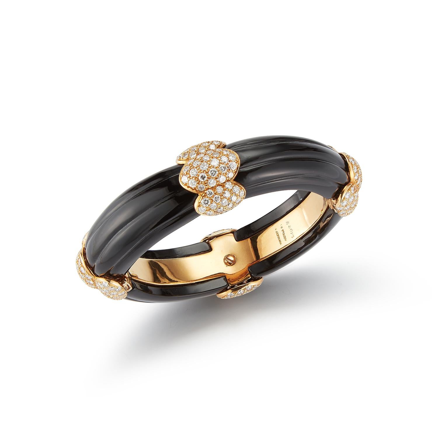 Onyx and Diamond Bangle Bracelet by Van Cleef and Arpels
Measurements: 15.5 cm 
Signed Van Cleef & Arpels and numbered
Gold Type: 18K Yellow Gold 

