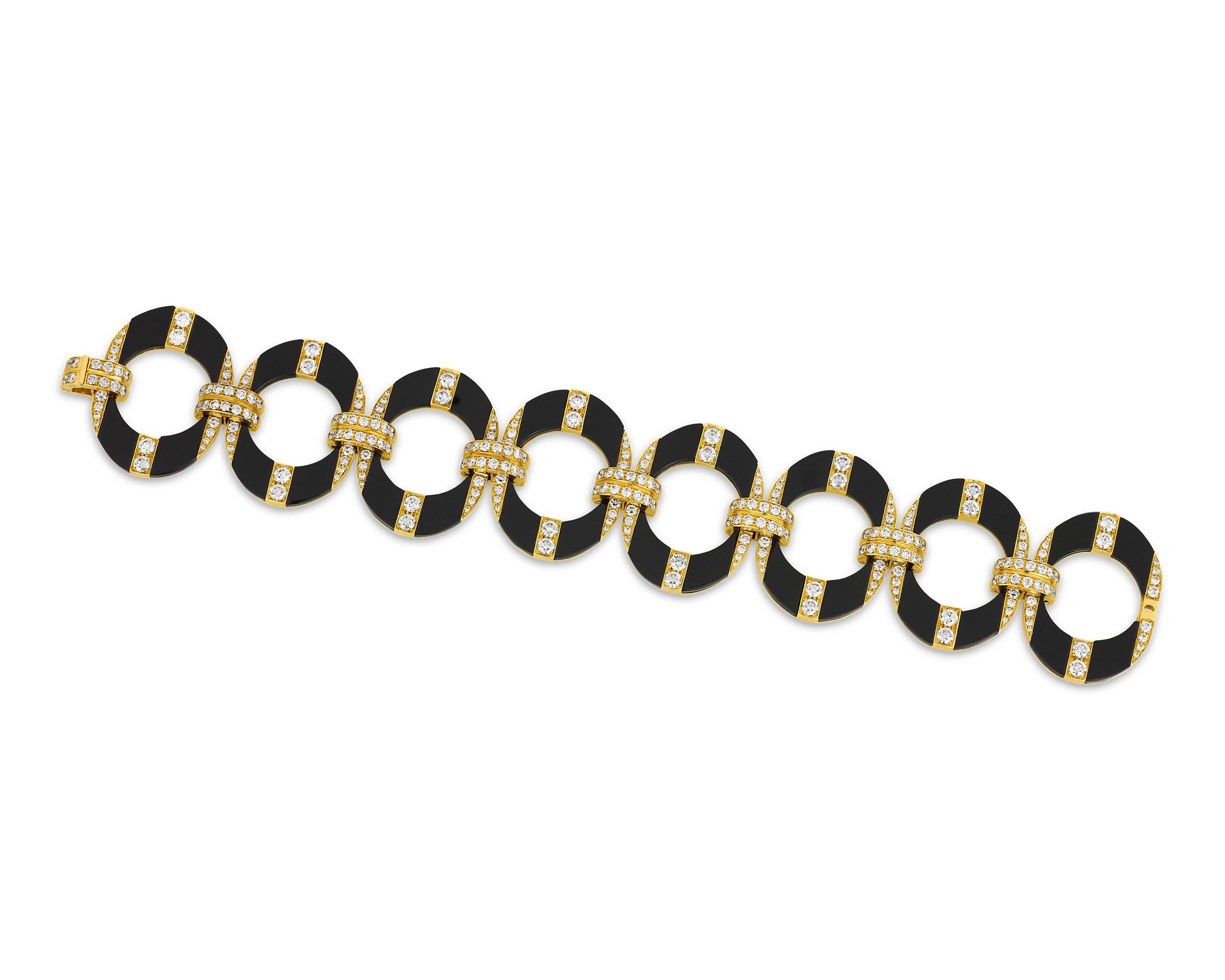 Charming and sophisticated, this bracelet from beloved Italian jeweler Bulgari contrasts the richness of onyx with the warmth of 18K yellow gold. The retro design utilizes arched mod motifs and glittering diamond accents to create a captivating