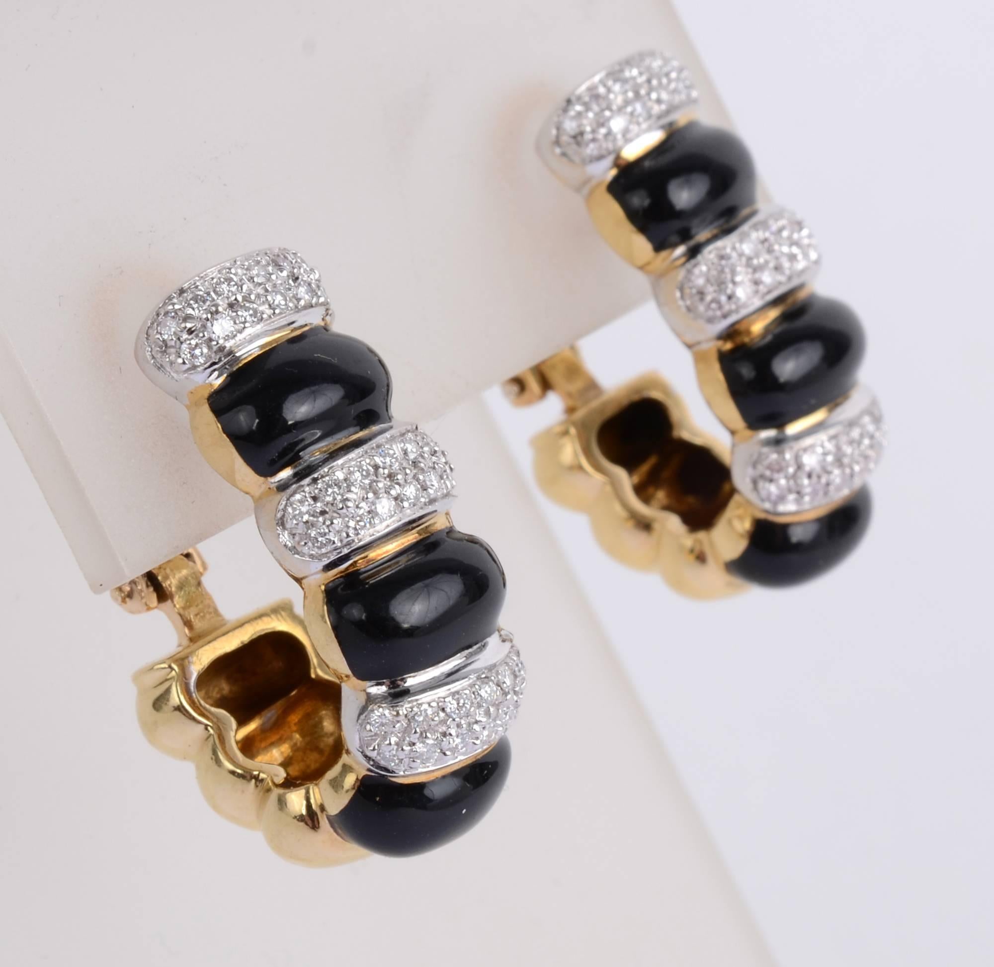 Snappy diamond and onyx elongated hoop earrings with both post and clip backs. Three plaques of black onyx alternate with three of pave diamonds.         The underside is made of three gold plaques that repeat the shape on the front. The diamonds
