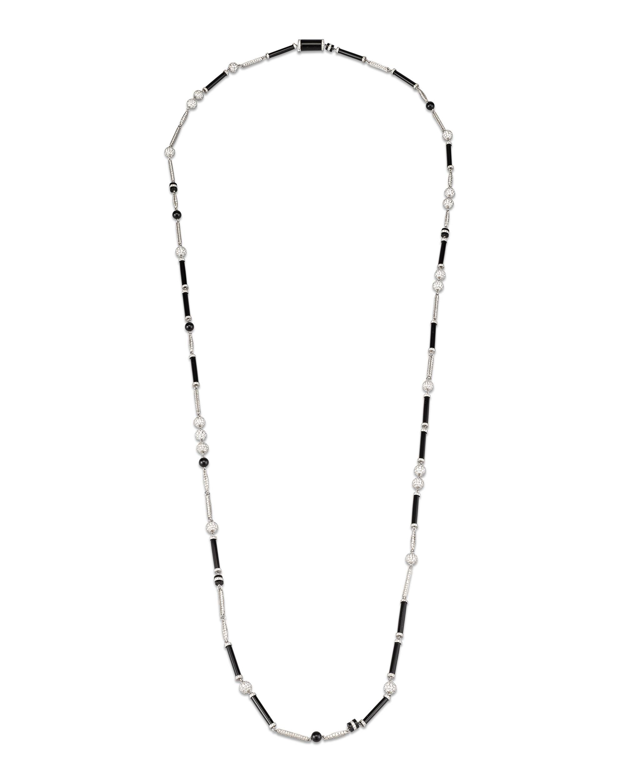 Smooth and elegant onyx is beautifully blended with shimmering diamonds in this sophisticated platinum necklace by Tiffany & Co. The array of spheres, bars and rondelles create a truly timeless and versatile look.

Signed 