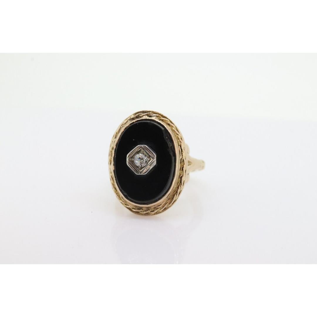 Vintage from the 1930s
Size: 3 1/4 US
Materials: Platinum
Gemstone: Onyx
Gem color: Black
Band color: Gold

Style: Art deco

Beautiful Onyx and Diamond ring. Bezel set.

14k Yellow Gold bezel and shank.

Ring is adjustable to fit Wide knuckles.