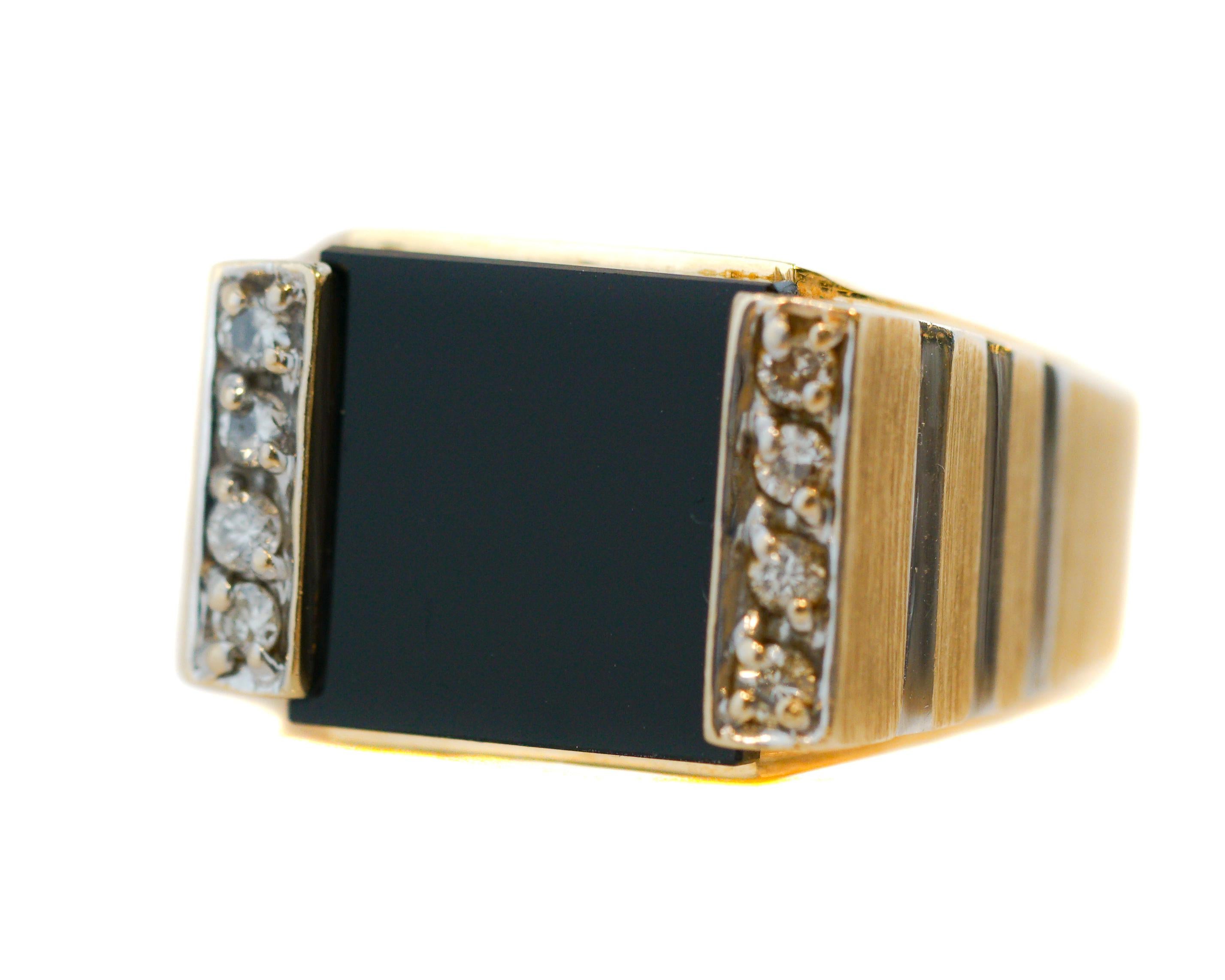 This modern, classically designed 14 karat Yellow Gold Men's Ring has elegant White Gold Accents. 

The strikingly contrasting Black Onyx Center Stone is flanked by 2 Rows of Round Brilliant Diamonds, 8 Diamonds Total weighing 1.2 carats total.