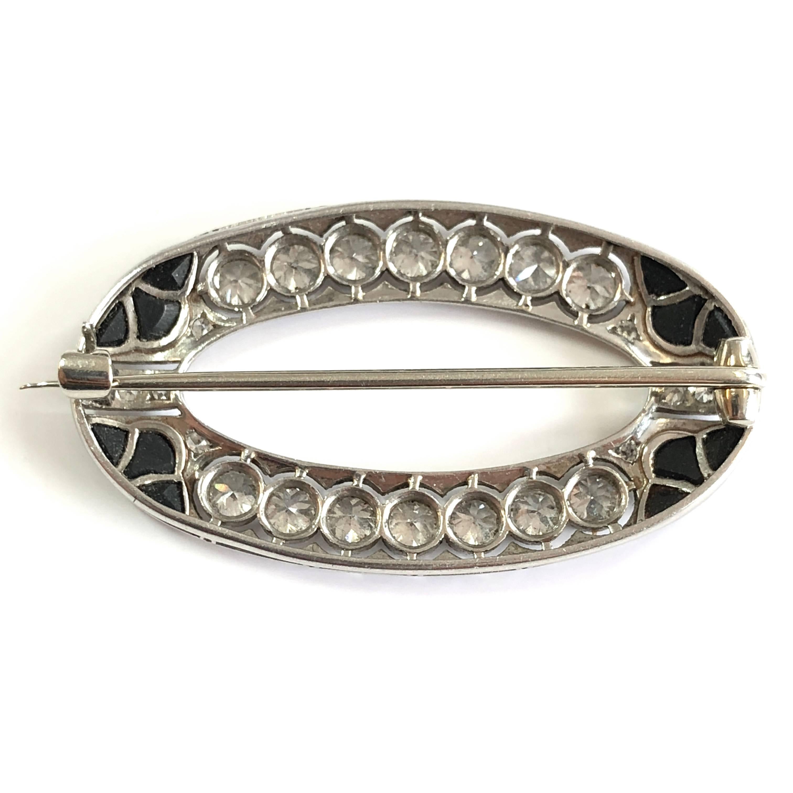 A very pretty Art Deco brooch with onyx and diamonds, ca. 1920s. The diamonds weigh circa 2 carats.
