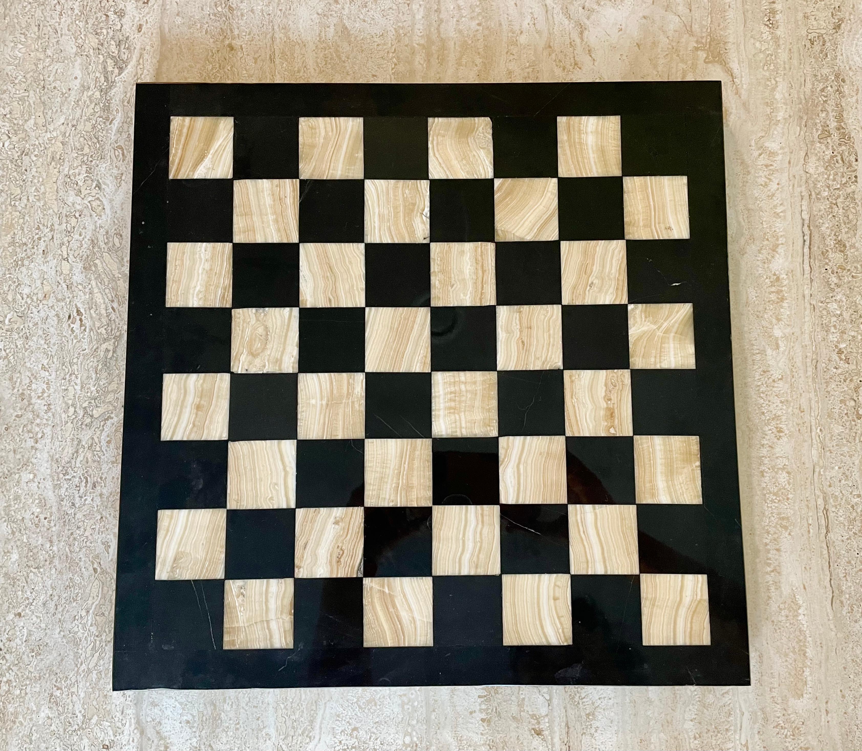 Onyx and marble chess board. Nuetral colored chess board that can be added to any game room. Chess pieces not included.