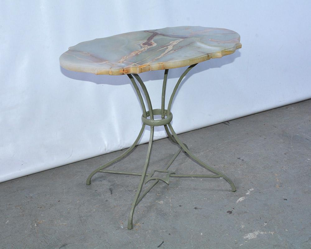 This elegant and beautiful serpentine shaped onyx stone top sits on a metal frame base. Table will complement a number of different rooms in your home as side table, end table or an occasional table.