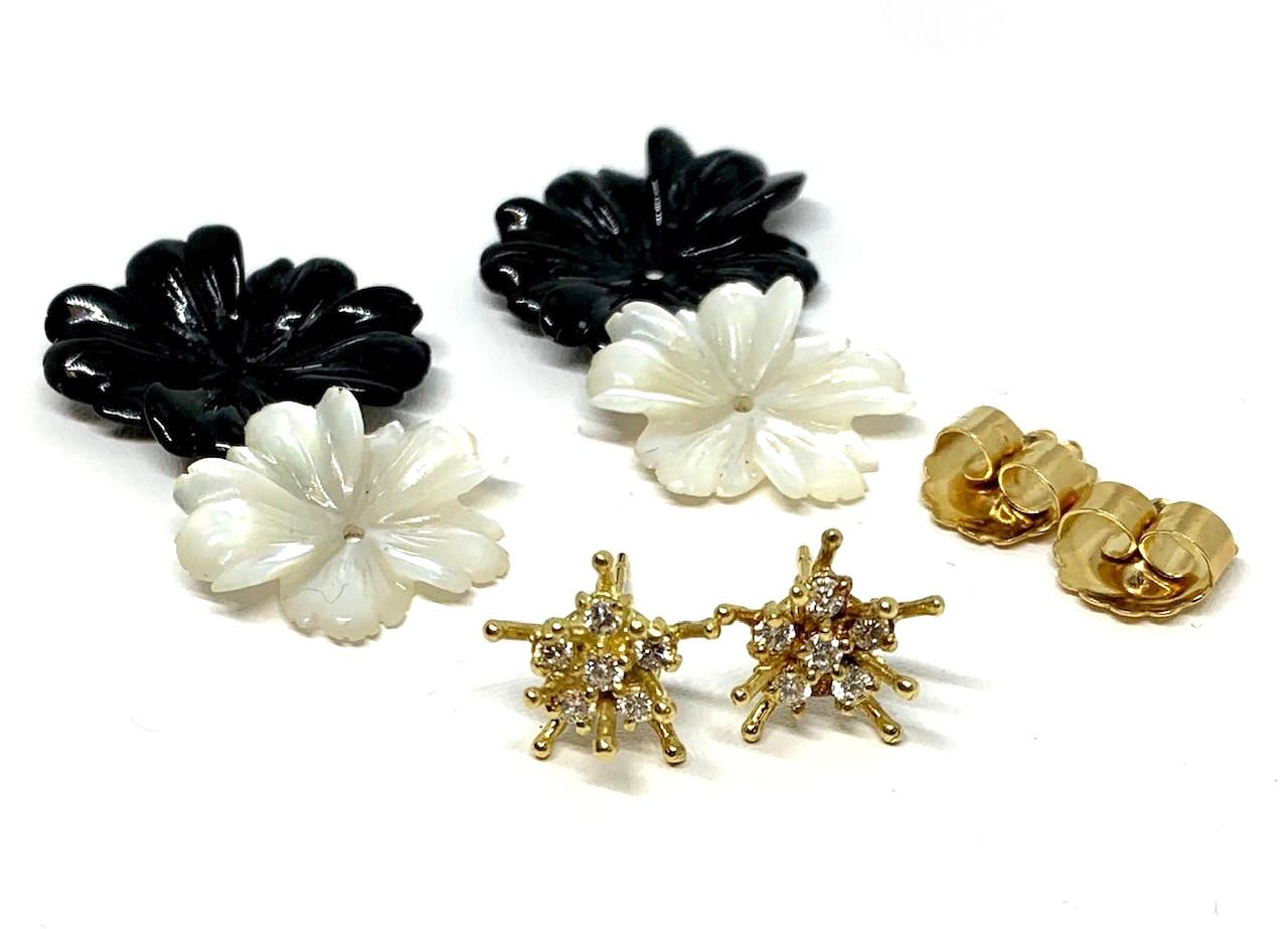 Interchangeable flower earring jackets are finely hand carved in onyx and mother-of-pearl. Gold and diamond 