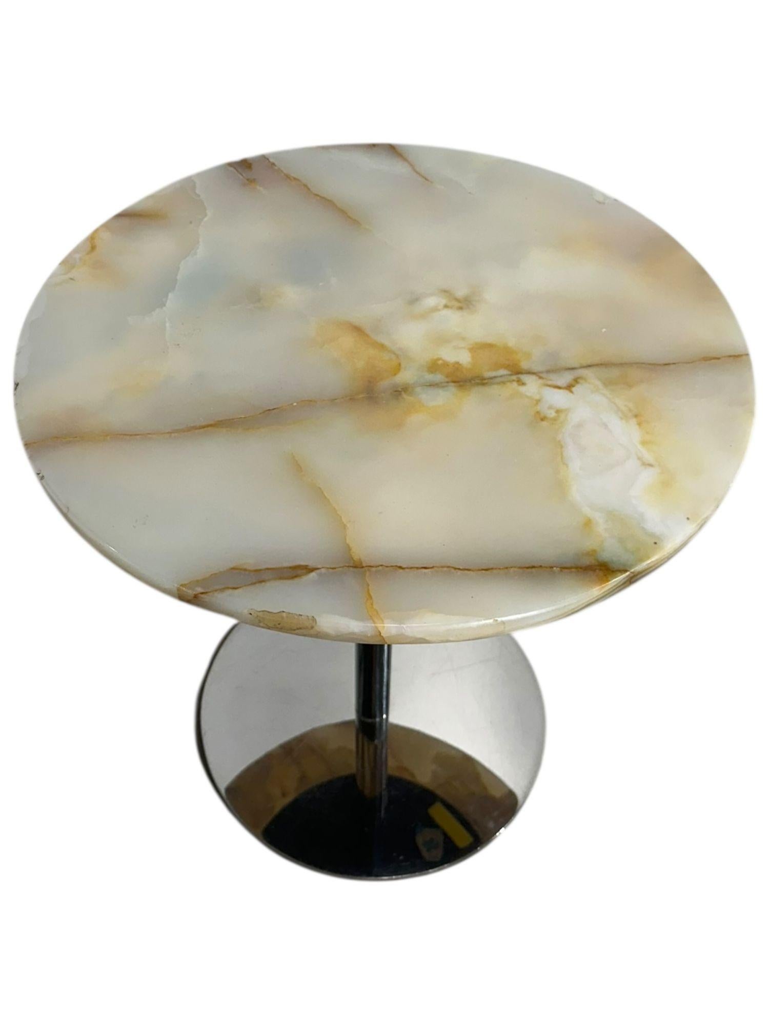 Onyx and Stainless Steel Side/End Table, 1970s.
Measures 18” diameter 18” tall