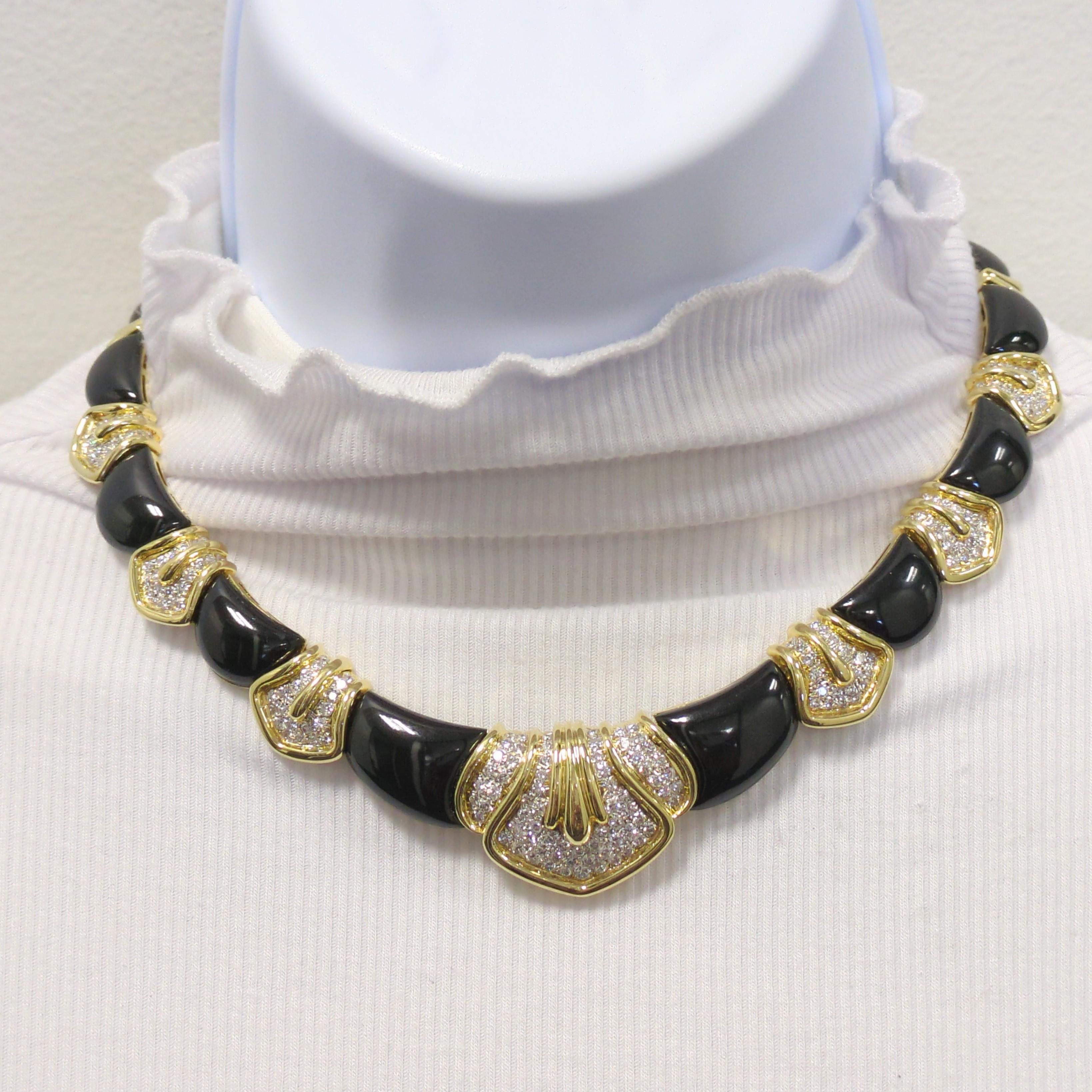 Beautiful estate necklace showcasing onyx and 4.50 cts. of good quality white diamond rounds in a handmade 18k yellow gold mounting.  This necklace has a stunning presence and a big look.  Approximately 13
