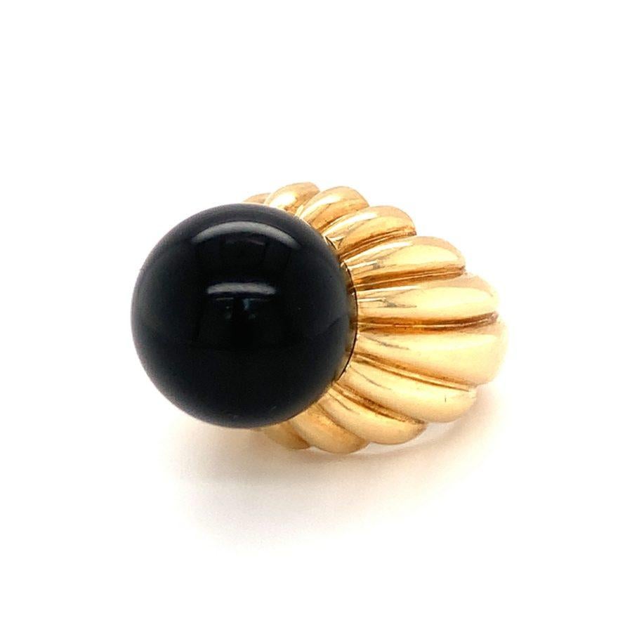 One black onyx bead 18K yellow gold ring featuring one round black onyx bead measuring 17 millimeters in diameter with ribbed fluted gold mount.

Grandiose, striking, bold.

Additional information:
Metal: 18K yellow gold
Gemstone: Black Onyx Bead =