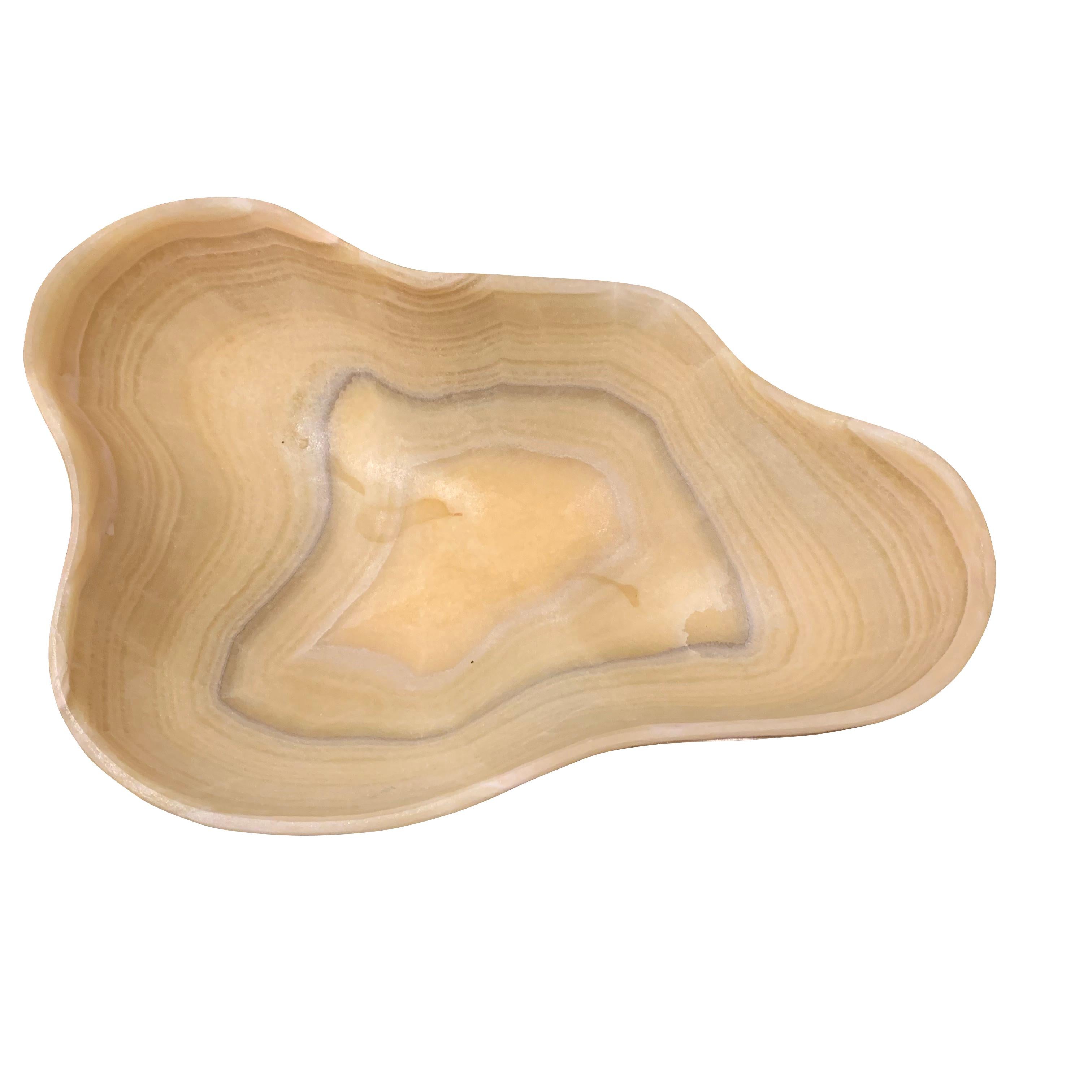 Contemporary Brazilian beautifully carved onyx bowl
Organic free form shape
Shades of yellow, cream and grey.