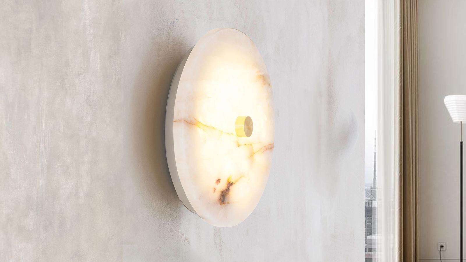 The Aurora Wall Light is inspired by the moonlight seen from within the Atlantic Forest. With a unique design of Onyx Cristallo rock, the sconce has the ability to filter light and create a more intimate and welcoming environment.

Onyx, in general,