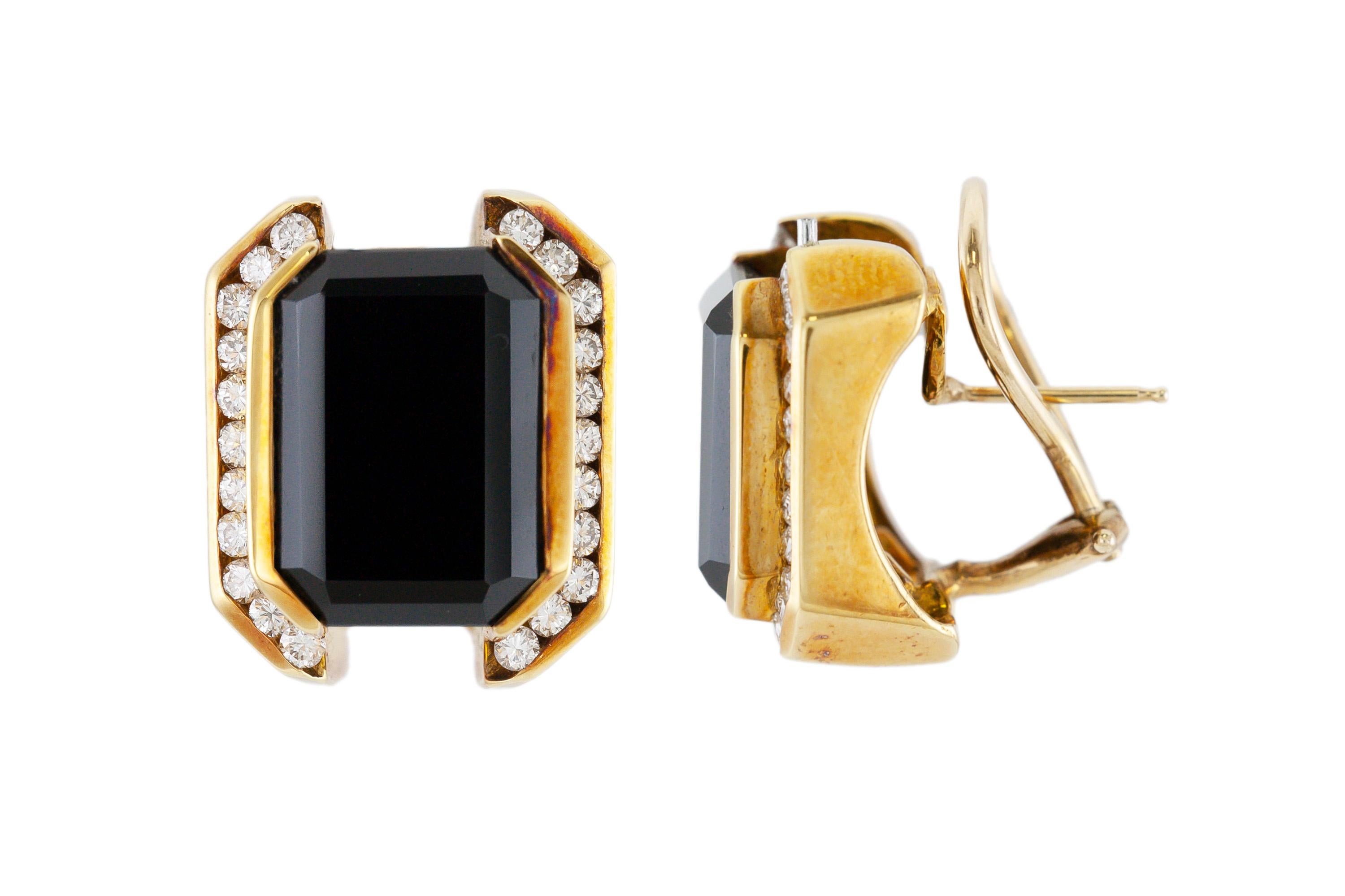 The earrings are finely crafted in 14k yellow gold with emerald cut onyx and round diamonds weighing approximately a total of 1.00 carat. Circa 1940.