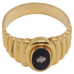 Bague en or jaune 18K avec onyx et diamant