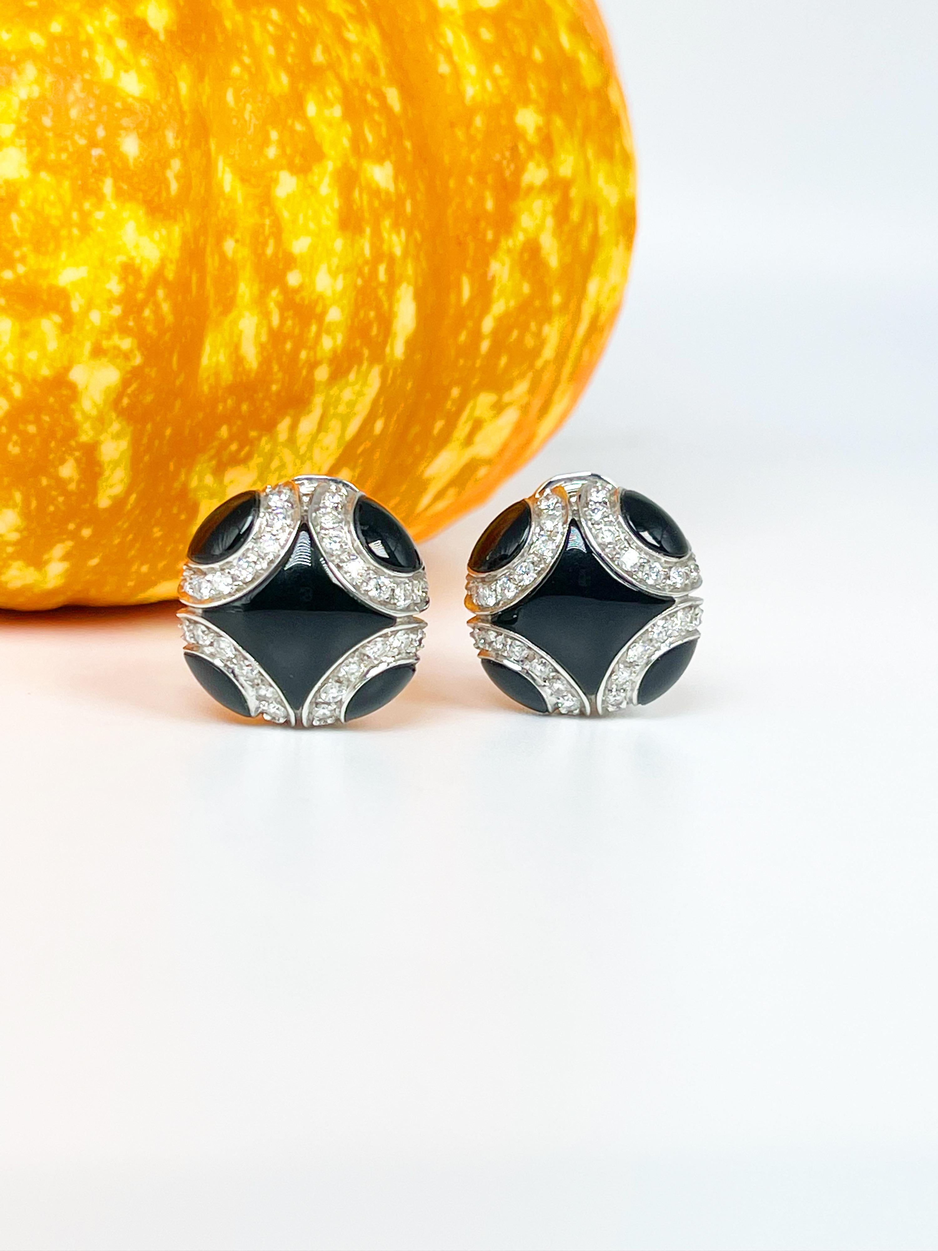 
Exquisite Onyx & Diamond Earrings in 18KT white gold by the designer Chantecler.

GRAM WEIGHT: 14.30gr
GOLD: 18KT white gold
CLOSIRE: OMEGA
NATURAL DIAMOND(S)
Cut: Round Brilliant
Color: F (average)
Clarity: VS (averge)
Carat: 1.12ct
Diameter: