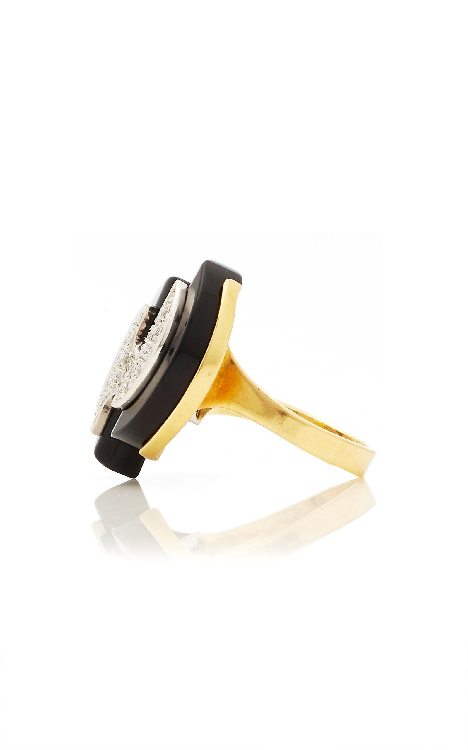 Geometrical design ring in yellow gold with onyx and diamonds. Circa 1970s.