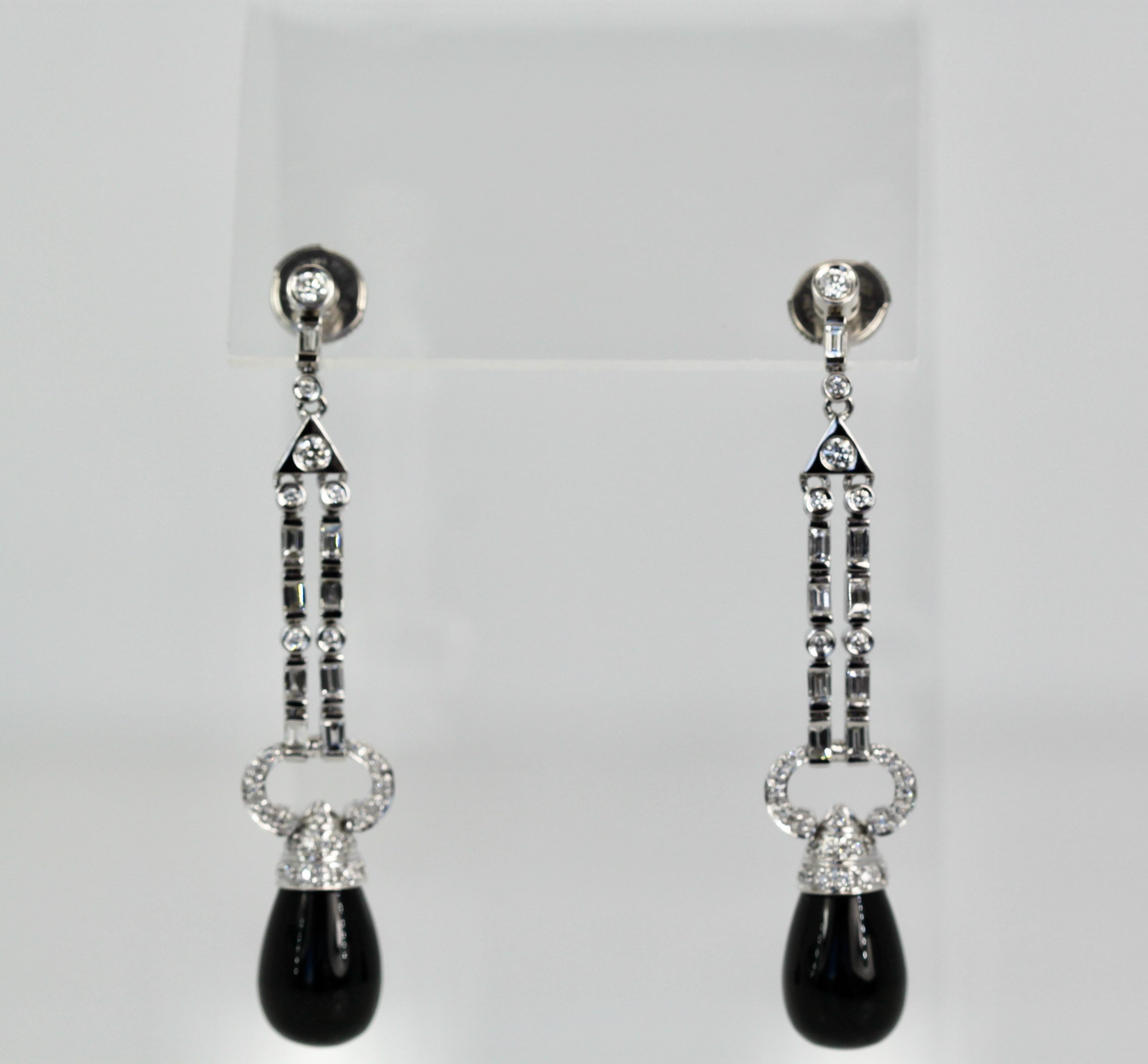 These lovely earrings are set with round Diamonds, baguette Diamonds and pave Diamonds all with an Onyx drop.  They are 2 1/4