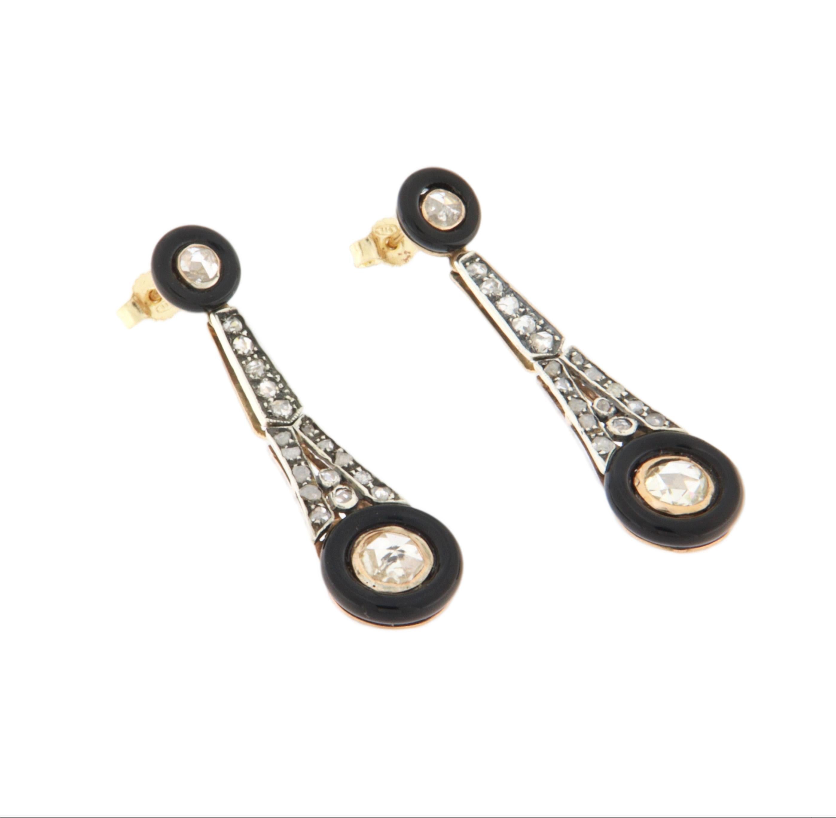 These refined earrings, crafted in 14-karat yellow gold and 800 silver, are a perfect example of timeless elegance, adorned with rose-cut diamonds and onyx rondelles. The combination of yellow gold and 800 silver gives these earrings a warm,