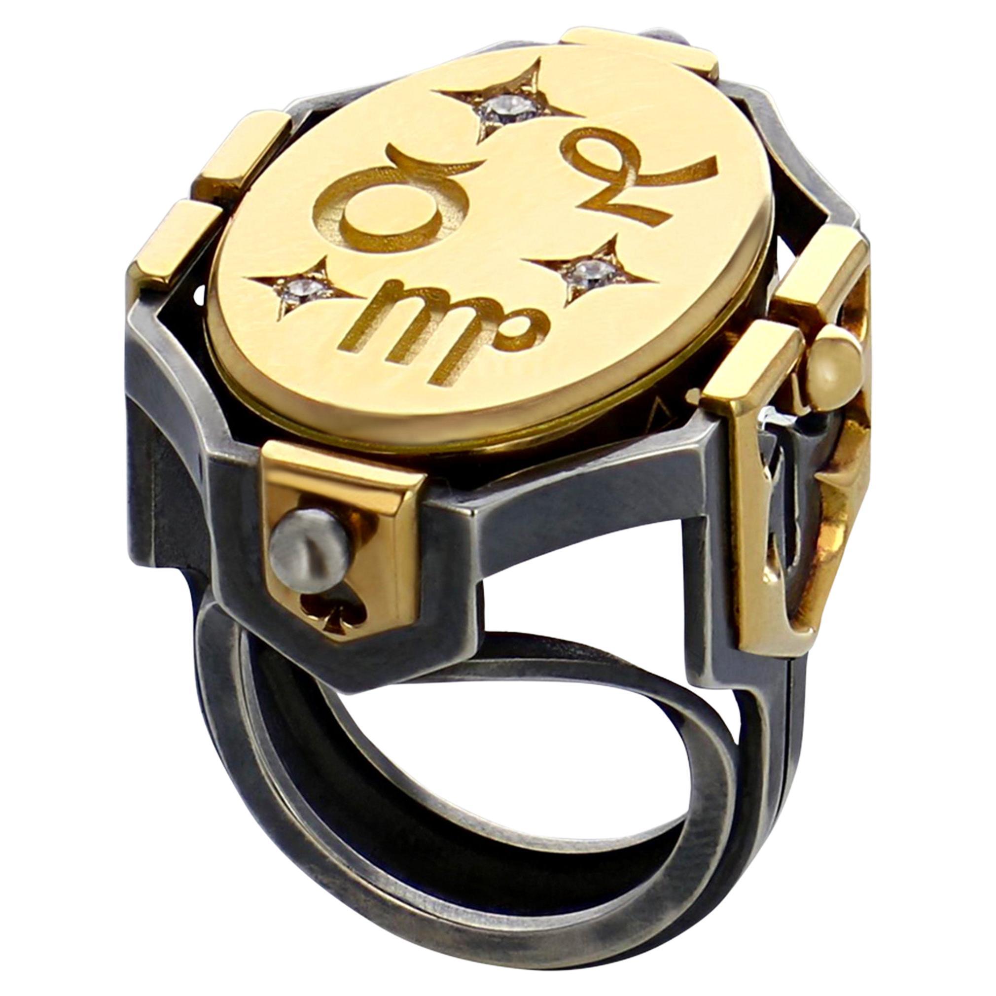 Yellow gold and distressed silver ring. Rotating medallion: on the gold side are engraved Earth signs (Virgo, Capricorn, Taurus) and on the onyx, a lion.

Details:
Onyx 
3 Diamonds: 0.1 cts
18k Yellow Gold: 18 g
Distressed Silver: 11 g
Made in France