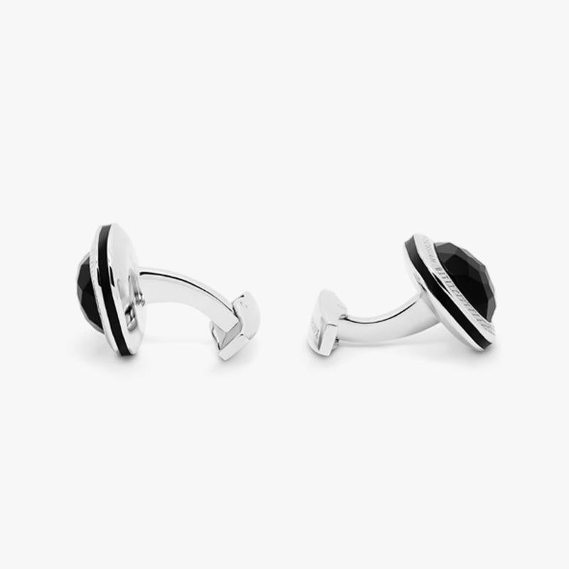 Onyx Doppione Cushion Cufflinks in Sterling Silver

Rose cut Onyx sits below a cabochon of quartz, cleverly combined to create a 'doublet'. This unusual collaboration of semi-precious stones inlay our classic square case, with black enamel detailing