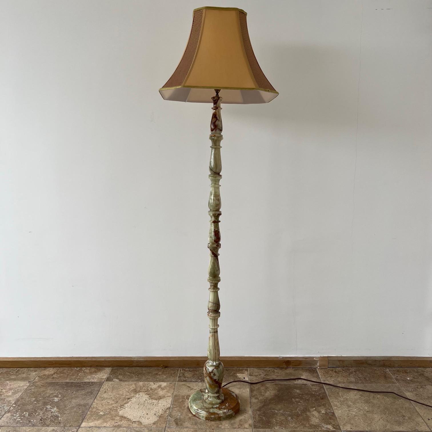 A tall onyx floor lamp. 

Particuarly nice model with good coloured onyx full of character. 

England, c1970s. 

Re-wired and PAT tested.

Dimensions are without the shade. Original shaded retained but wants replacing with something more
