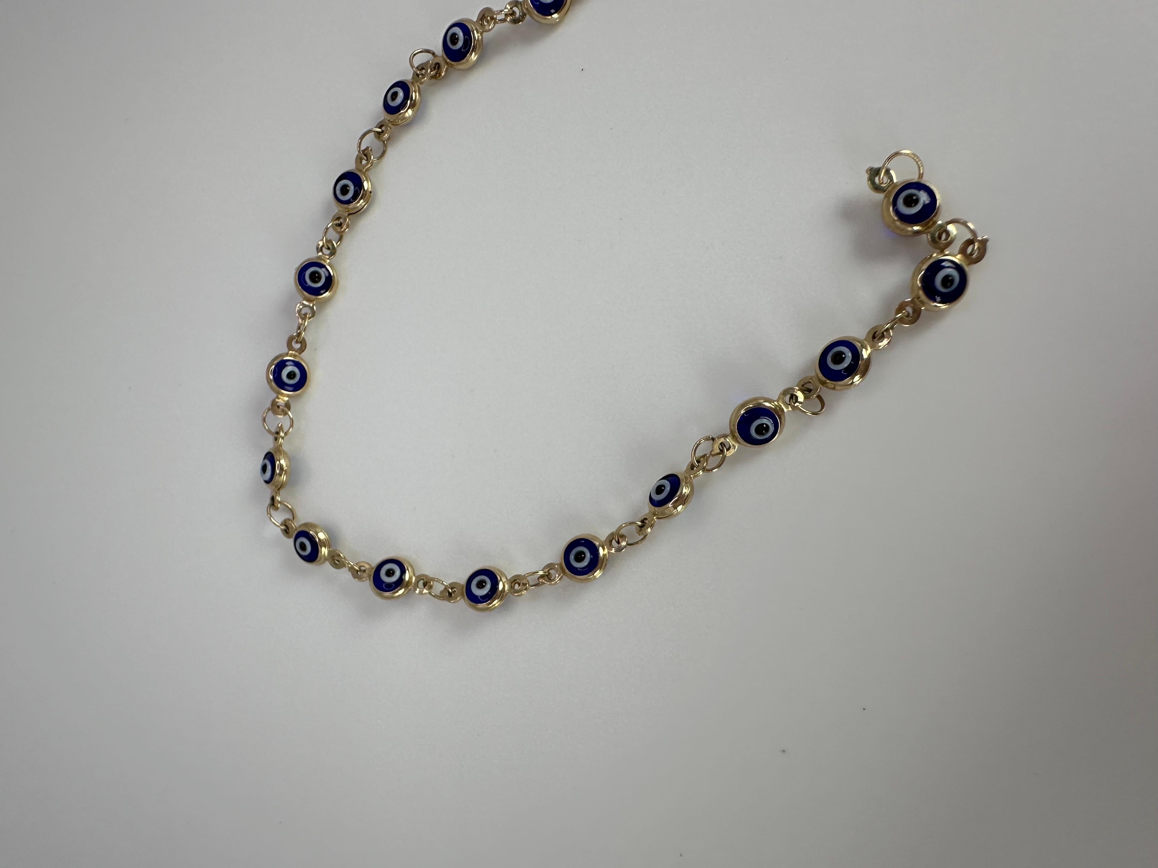 Pulsera de mal de ojo en oro de 14 quilates, hecha a mano con ónix natural, muy cómoda de llevar en la mano. Viene con un certificado de autenticidad y una bonita caja, ¡lista para regalar!

LO QUE SE OBTIENE EN LA JOYERÍA STAMPAR:
Stampar Jewelers,