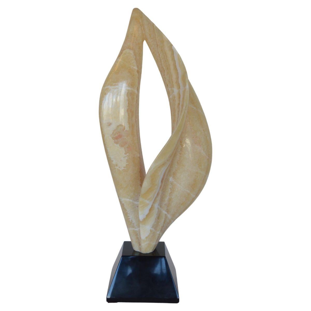 Smooth flame sculpture carved from onyx. 

Dimensions:
31.5