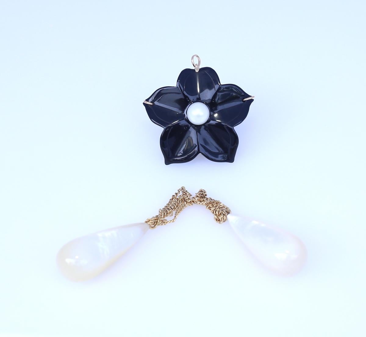 Onyx flower with two detachable Mother-of-pearl pendants. 14K Gold.  1930.
Really fine and stylish item. It can be worn as a brooch or as a pendant. There is a special loop on the back for the chain. Can be separated from the two mother-of-pearl
