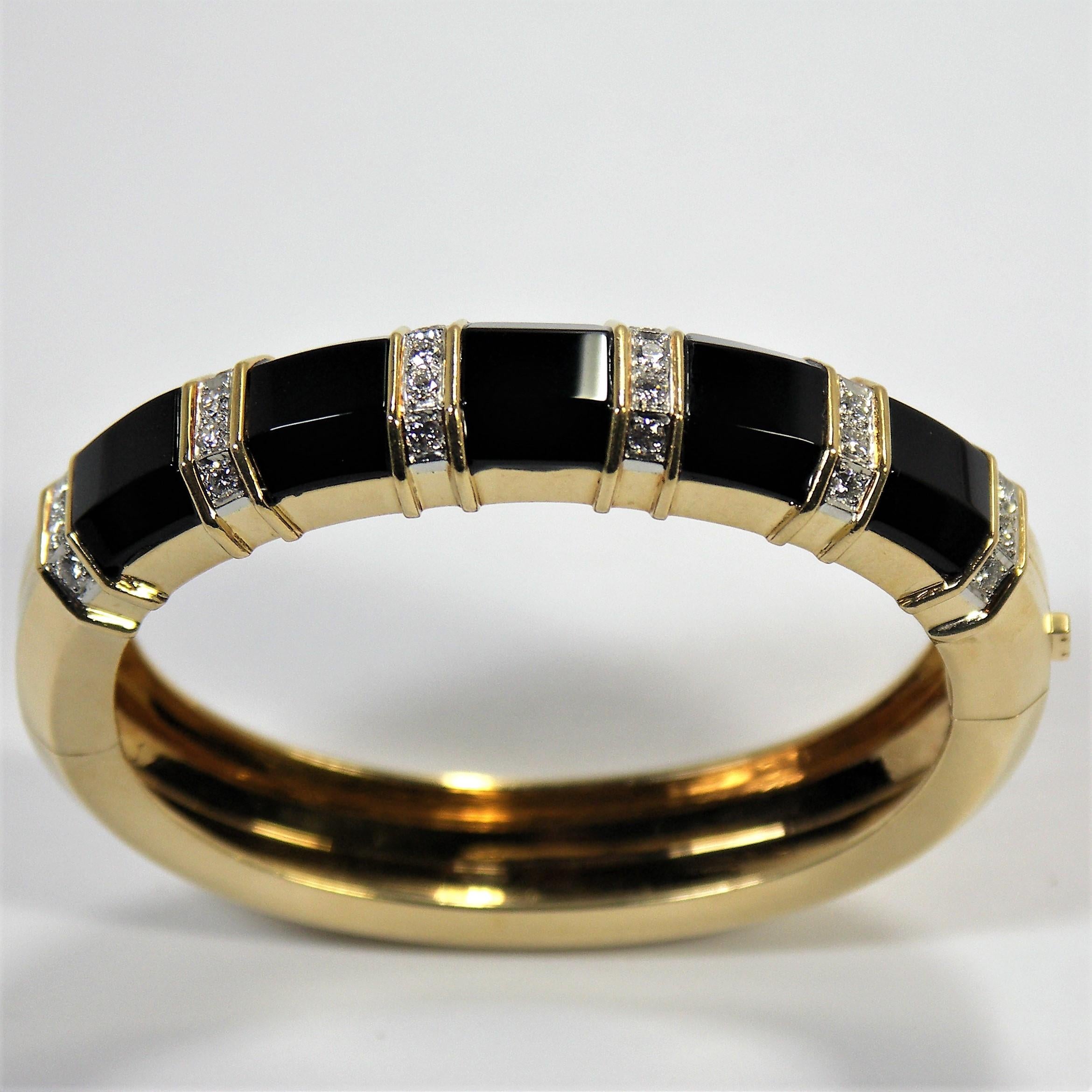 A great every day bangle for any woman who wants an outstanding casual bracelet.
It is smart, tailored and elegant, all at the same time. Made of 18K Yellow Gold and
set with 24 round brilliant cut diamonds weighing an approximate total of 1.25Ct