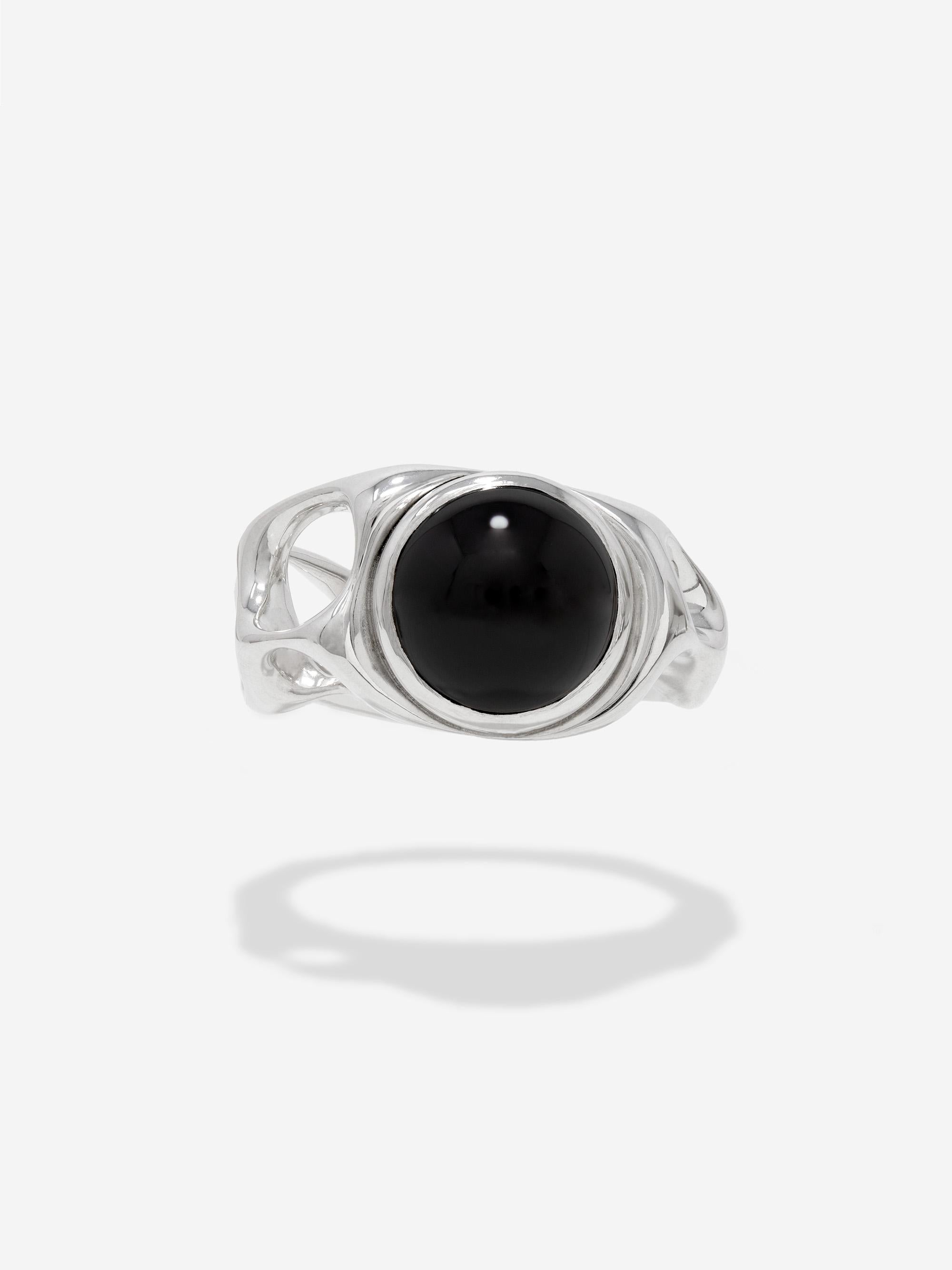 CAPTIVE- The Onyx Horizon ring is an ode to celestial giants, frozen in their collapse. A 10mm black onyx cabochon is set into hand carved sterling silver massed ring.