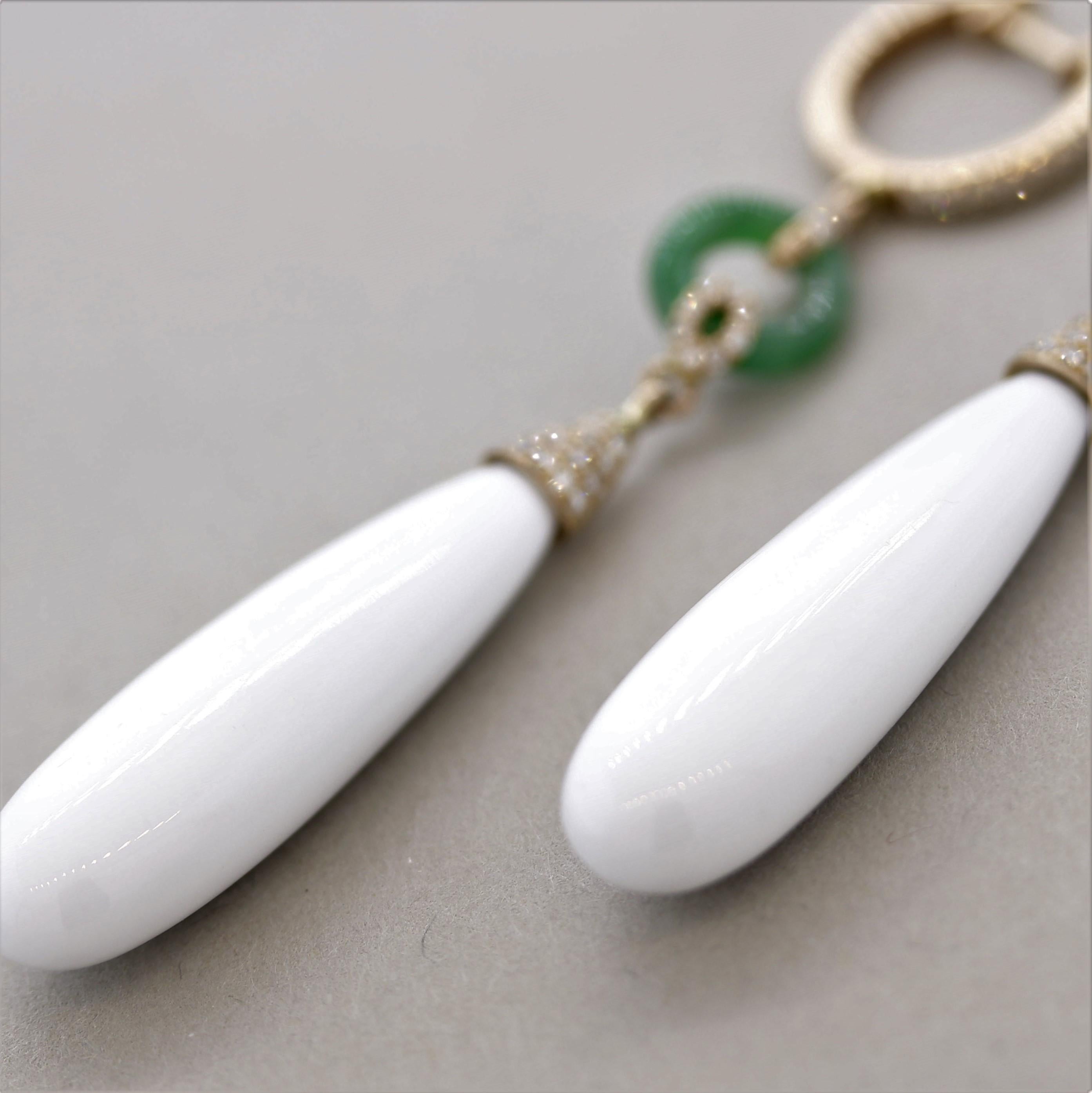 A stylish and chic pair of drop earrings! They feature 27.35 carats of smooth drop-shaped white onyx. Accenting them are 0.41 carats of round brilliant-cut diamonds which add sparkle and brilliance to the piece. Finishing the earrings are two